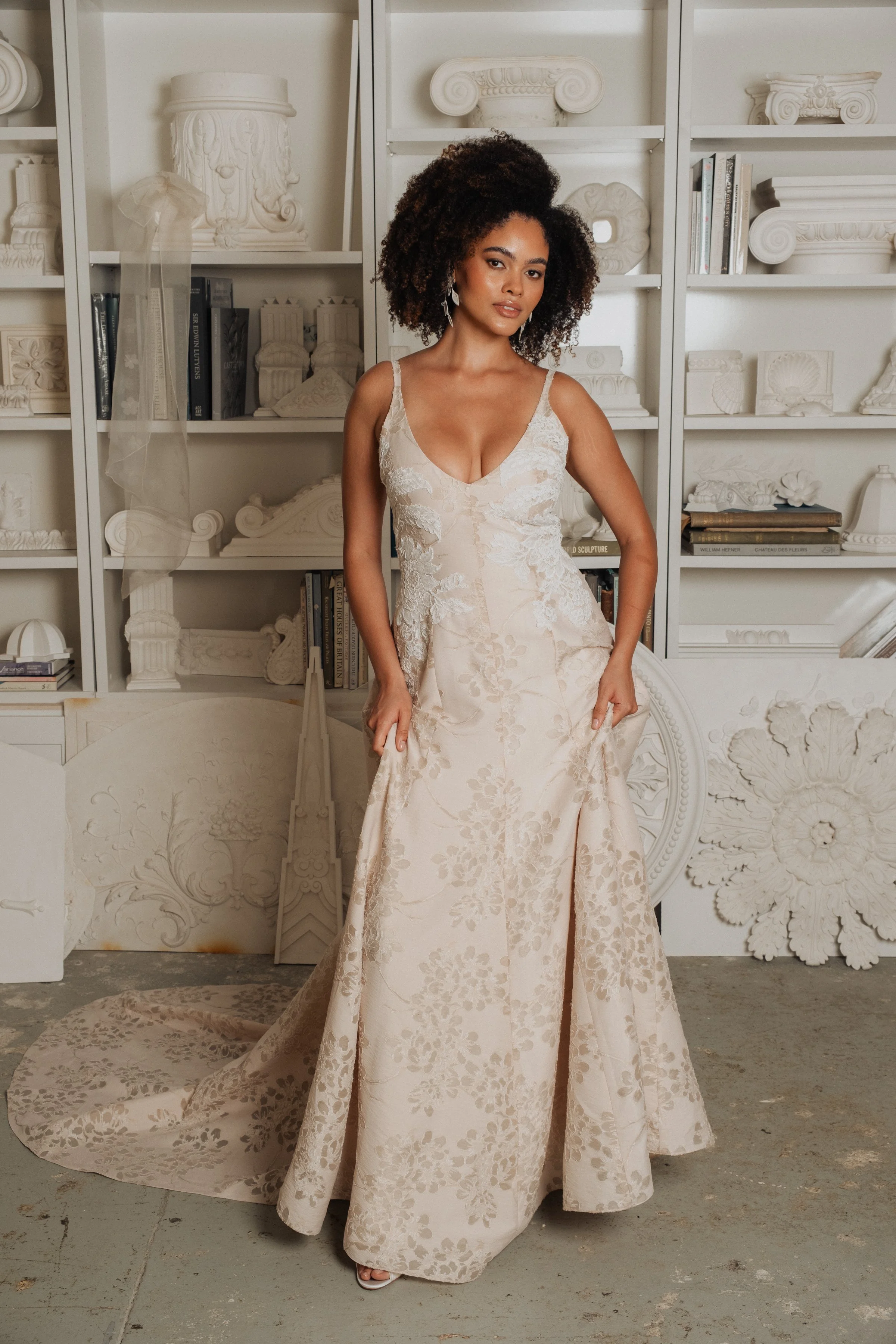 Fit and flare princess seam wedding dress with deep v-neck in