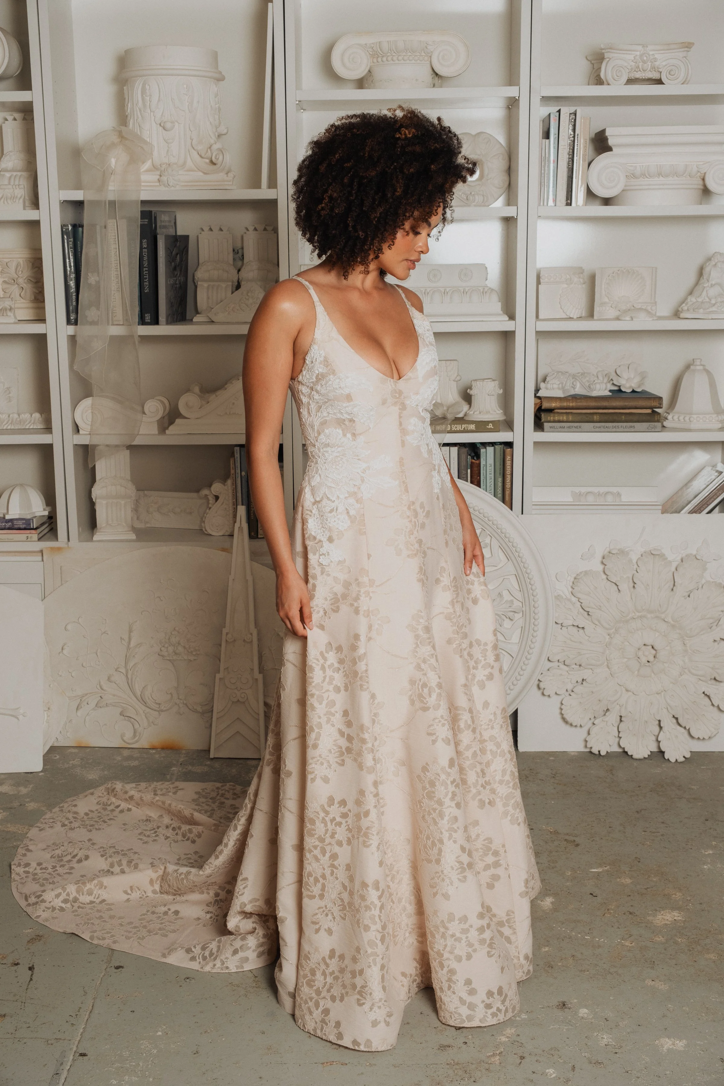 Fit and flare princess seam wedding dress with deep v-neck in