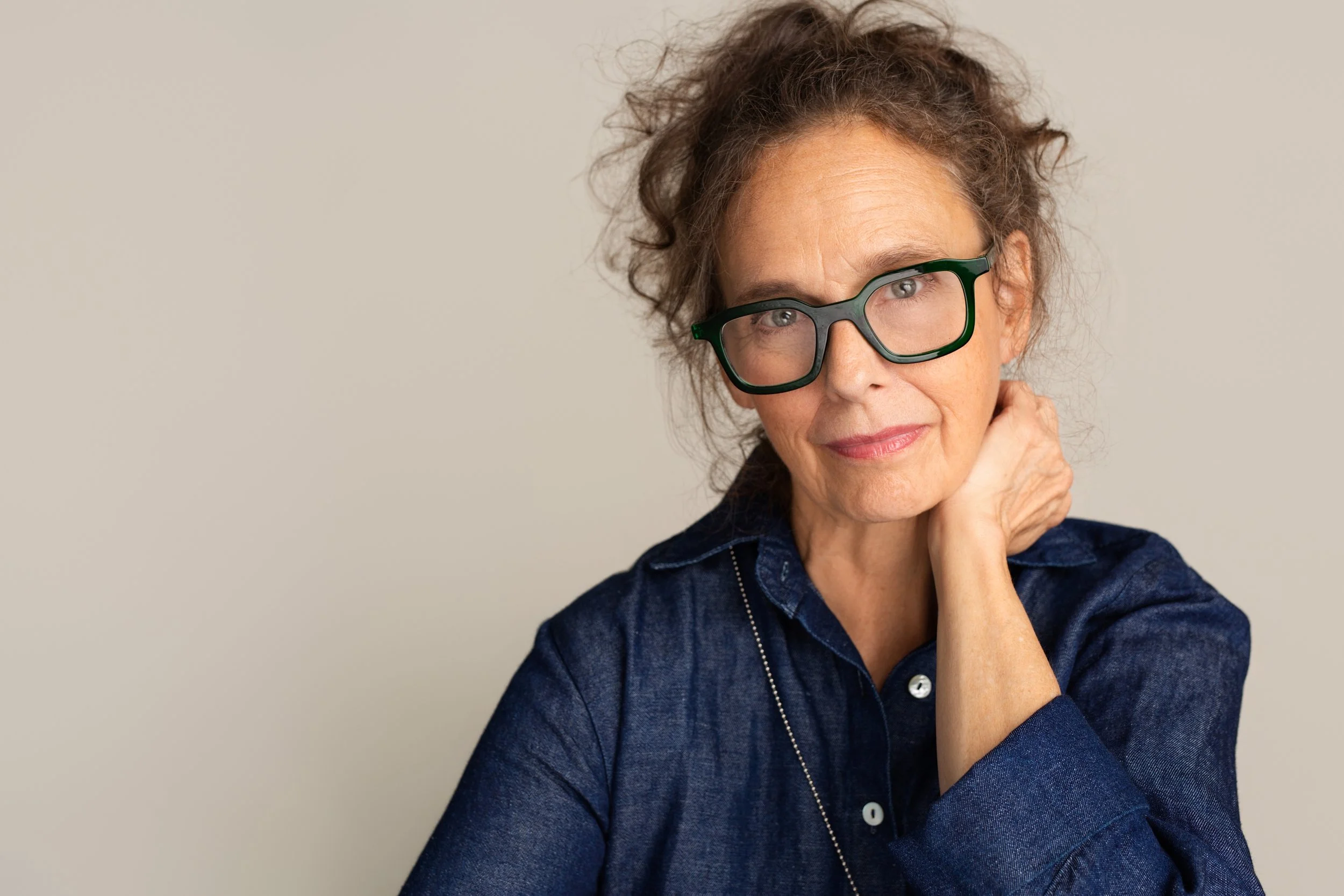 Confident studio headshot of a professional therapist photographed in Vancouver.