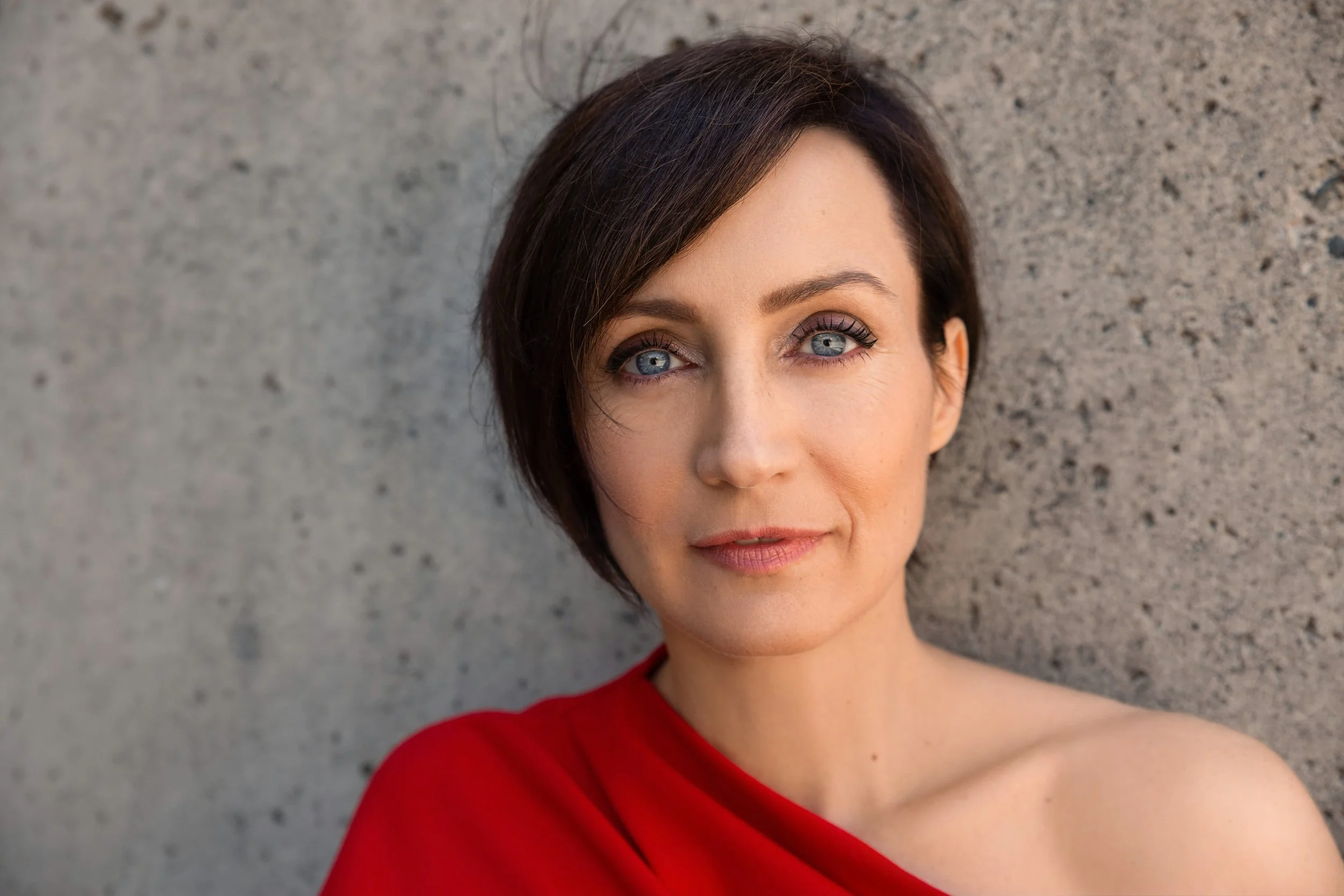 Professional woman captured during a modern portrait session in a Vancouver studio.