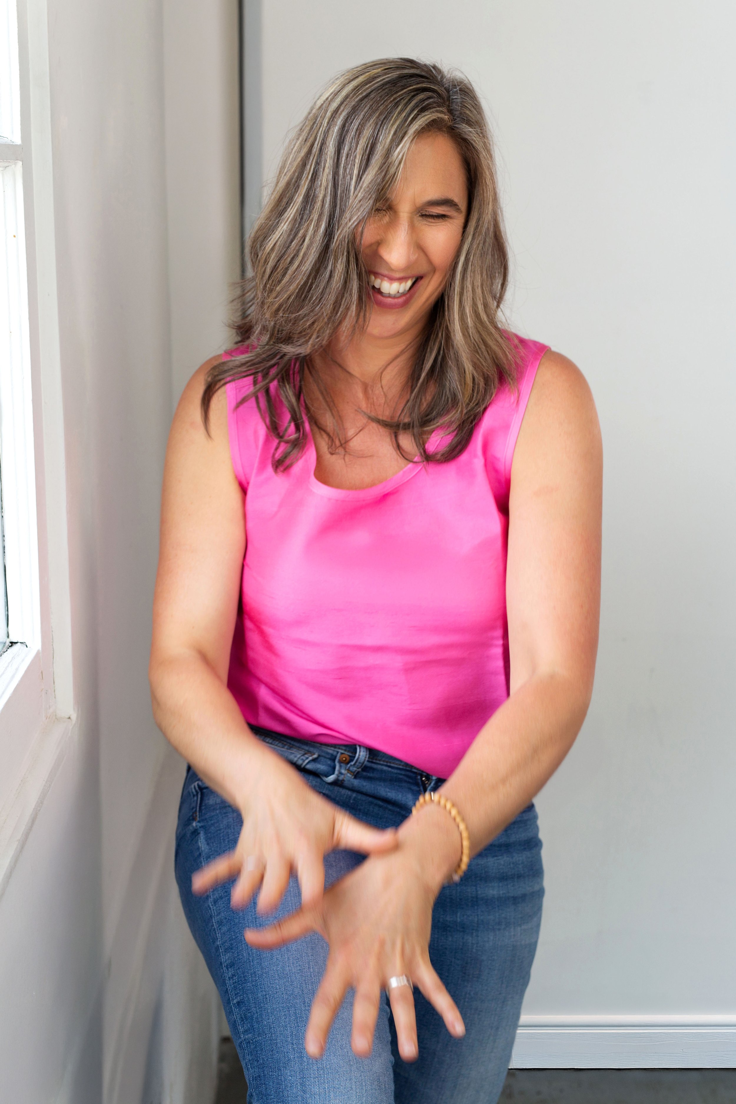 Fun professional portrait of a business owner taken in a Vancouver studio.