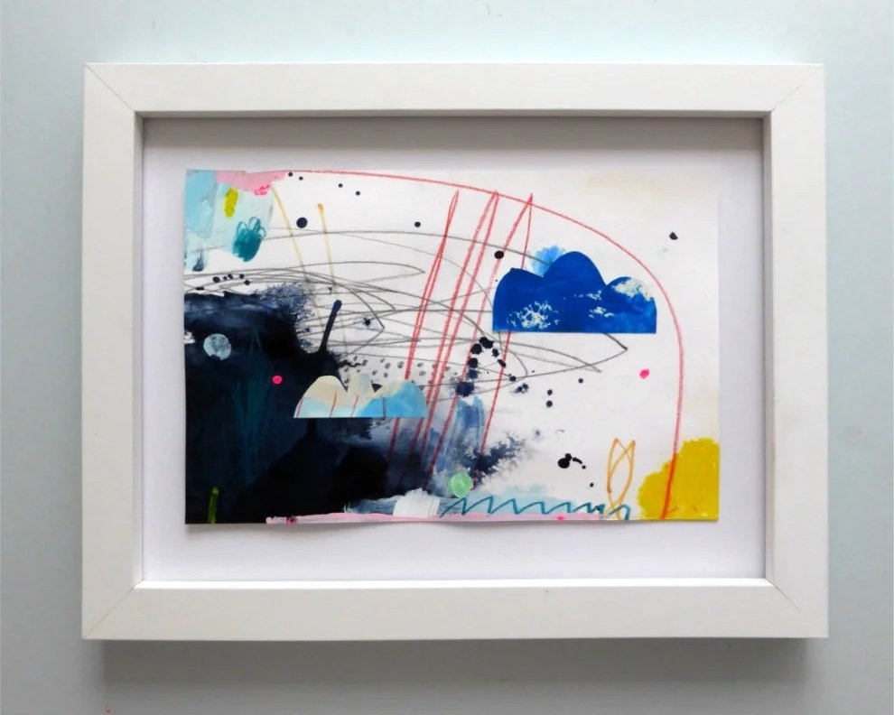 Abstract colorful painting with splashes of blue, black, pink, and yellow, featuring red lines and clouds, framed in white.