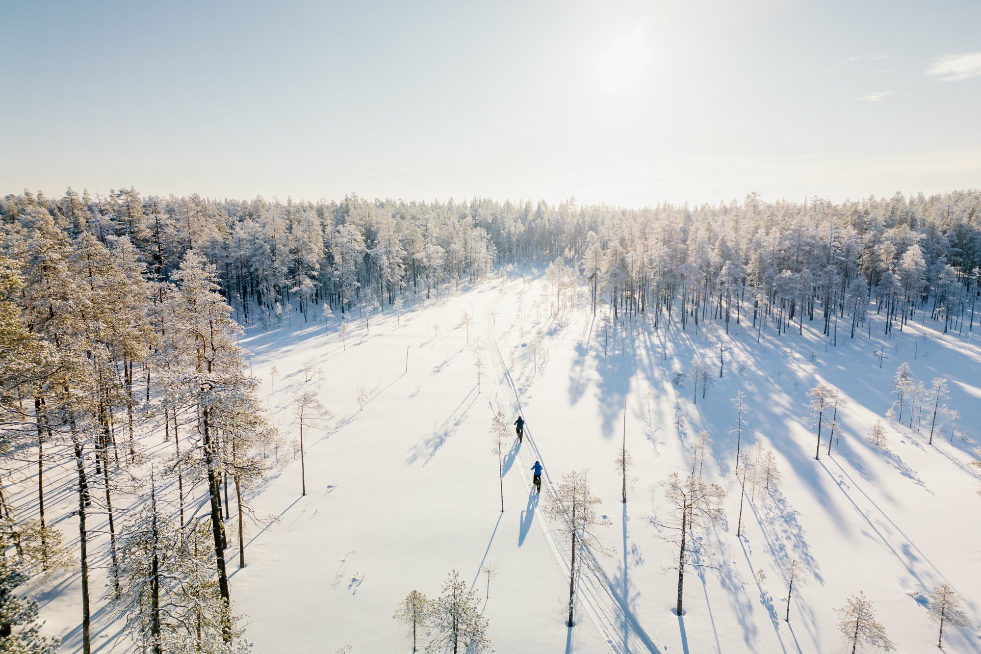 Suomussalmi-talvi-winter-finland-kainuu-arctic-snow-bicycle-happy moment-finnish nature-pure nature-cold day-winter scenery-drone shot-drone image-ilmakuva-talvimaisema©Filved Agency.jpg