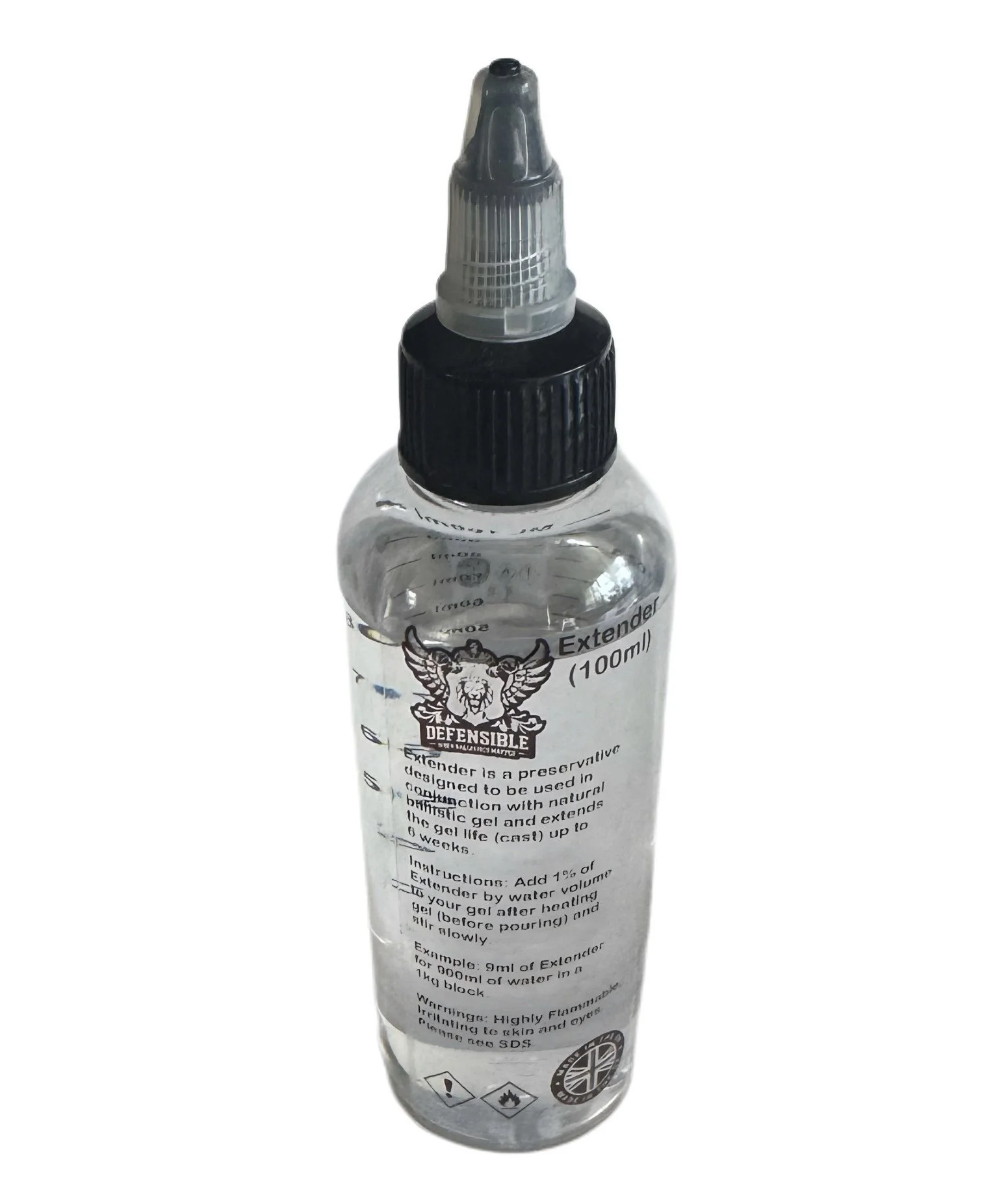 A small transparent plastic bottle with a black and clear twist cap, containing a preservative liquid called "Extender".