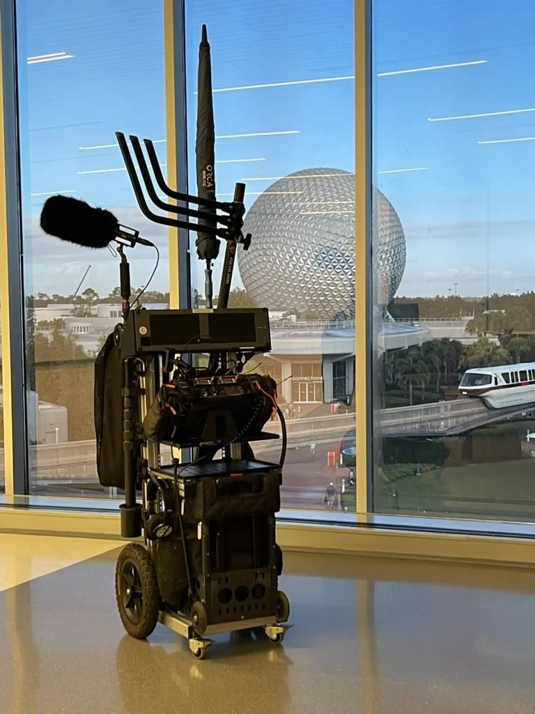 High Five Sound production sound cart with boom pole and wireless rack in front of Spaceship Earth at Epcot
