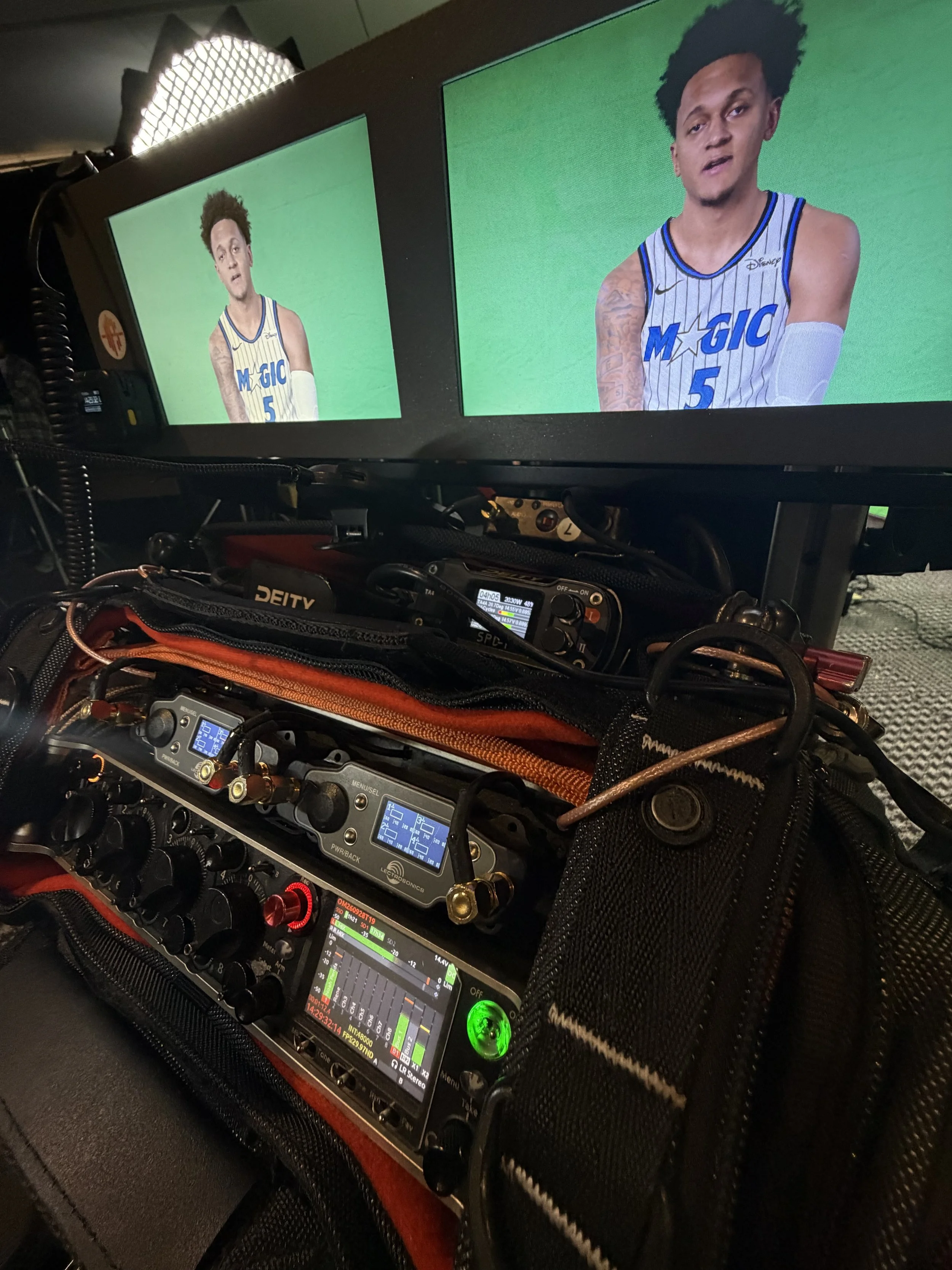 Behind the scenes shot of Production sound mixer Edson Alvarez Sound Cart Mini with Black Magic Dual Monitors w Paolo Banchero in the Interview seat on Orlando the Magic Media Day for NBC, ESPN and Amazon Prime