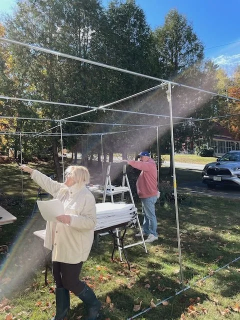 Sukkah takedown 2025 - Nancy and Geoff organize .jpeg