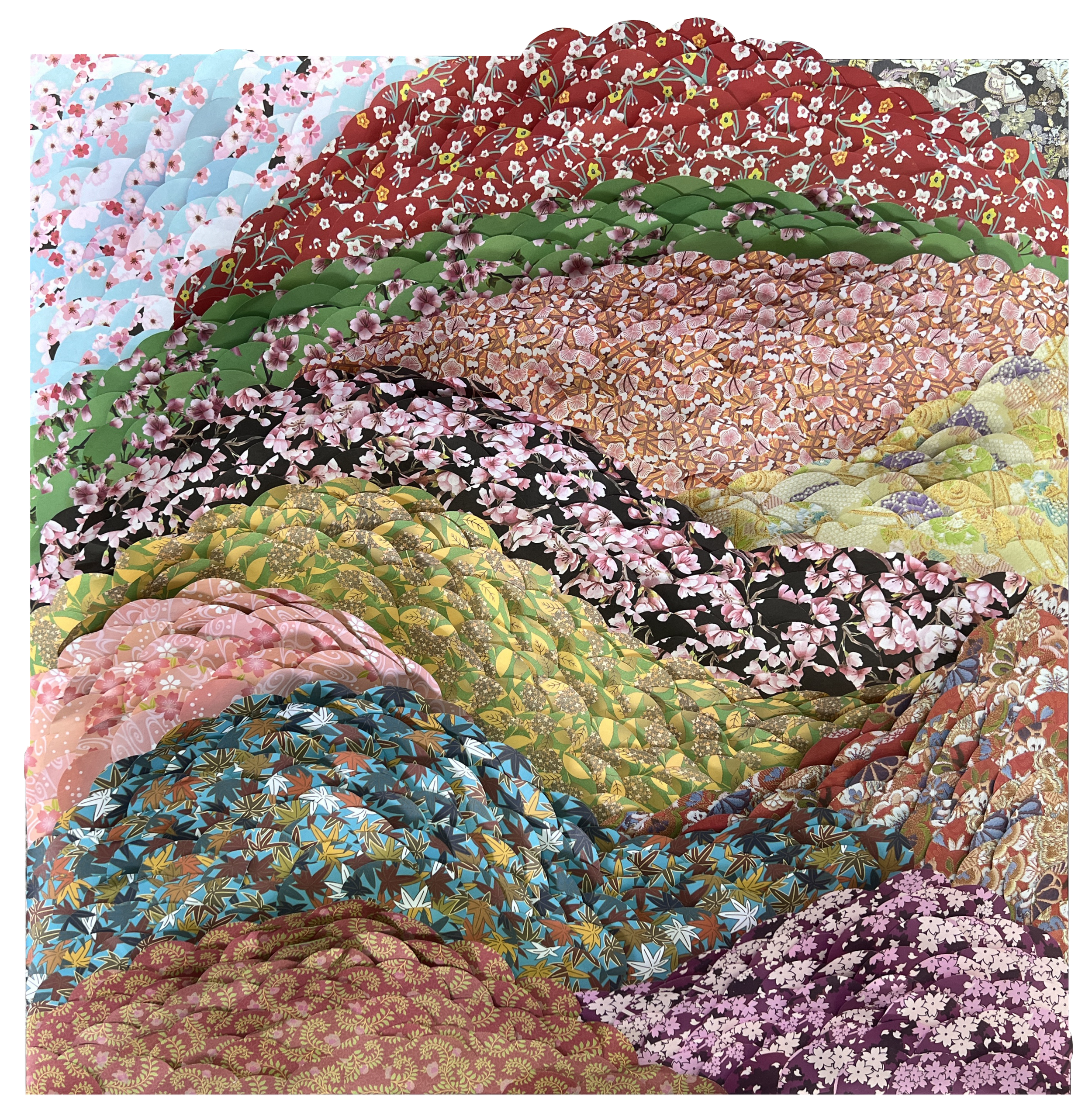 Colorful stacks of traditional Japanese kimono fabrics with various floral patterns and designs.