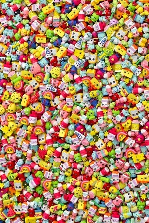 A large collection of small, colorful toy figurines and characters.