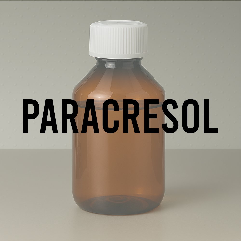 Amber laboratory bottle labeled “paracresol” representing a synthetic fragrance base used in perfumery.