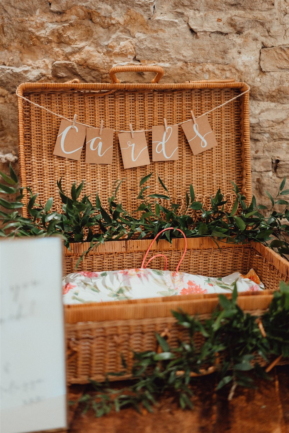 Basket for wedding cards with simple foliage garland around it. English garden wedding.jpg