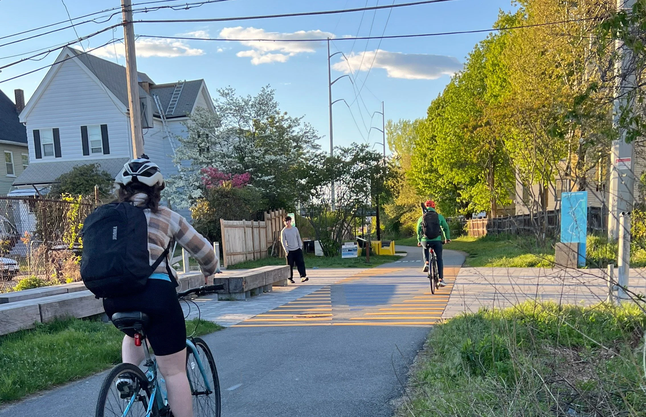 Bicyclists traveling on the Northern Strand bike path through West and Wellington plaza in Everett