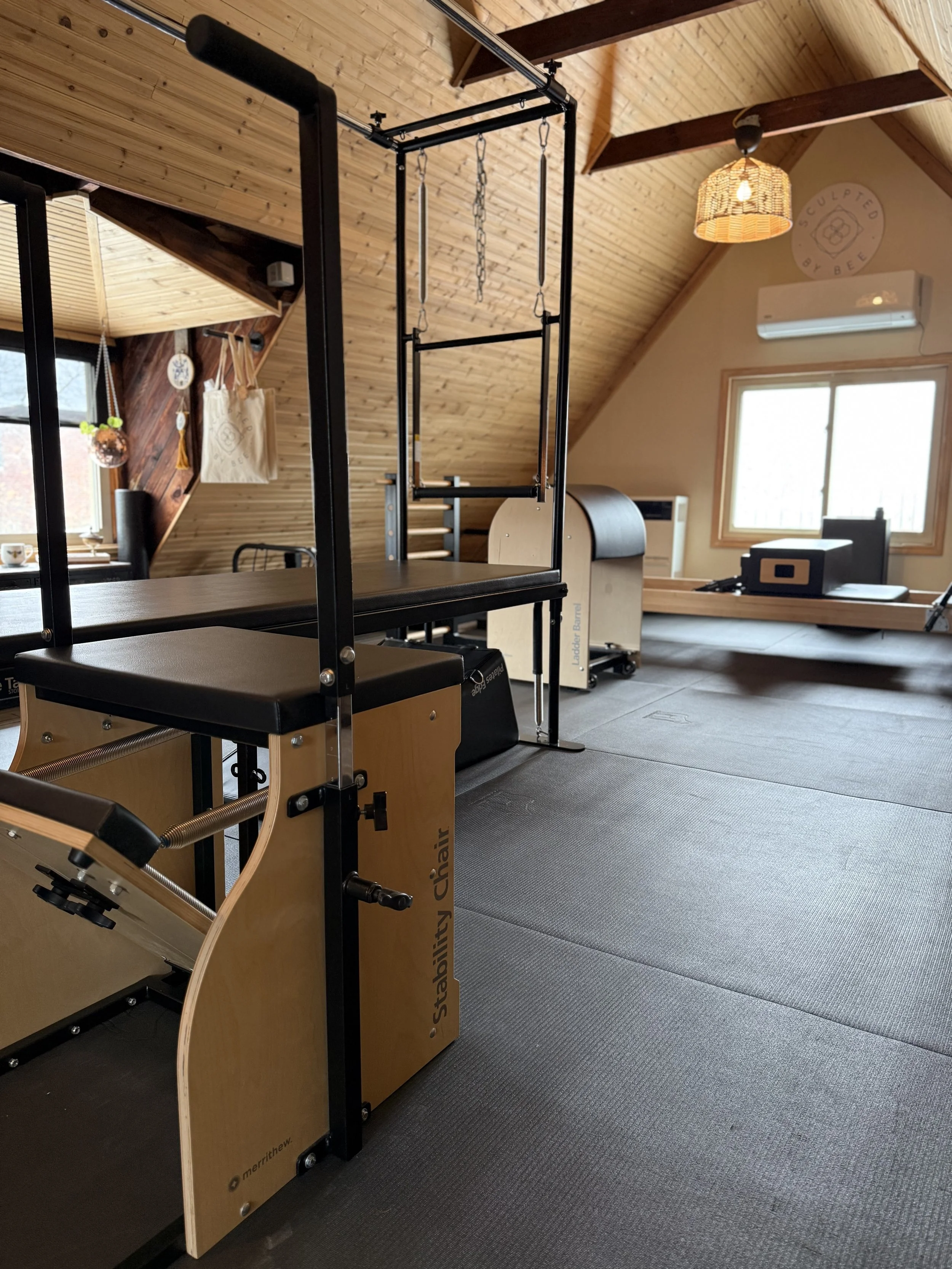 Pilates Cadillac and stability chair in Sculpted By Bee private studio, Grosse Pointe Park, MI
