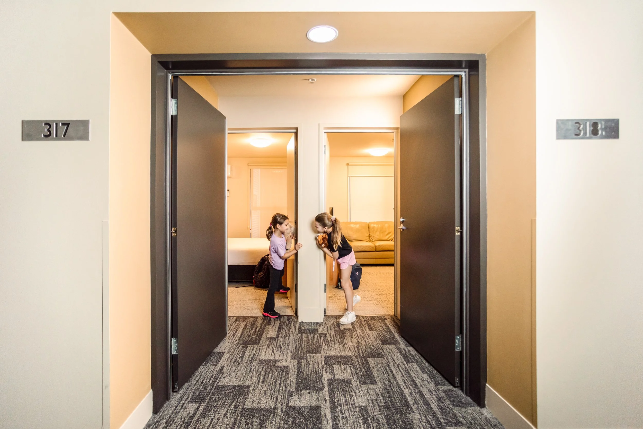 Family at their secure and private connected apartment entrance