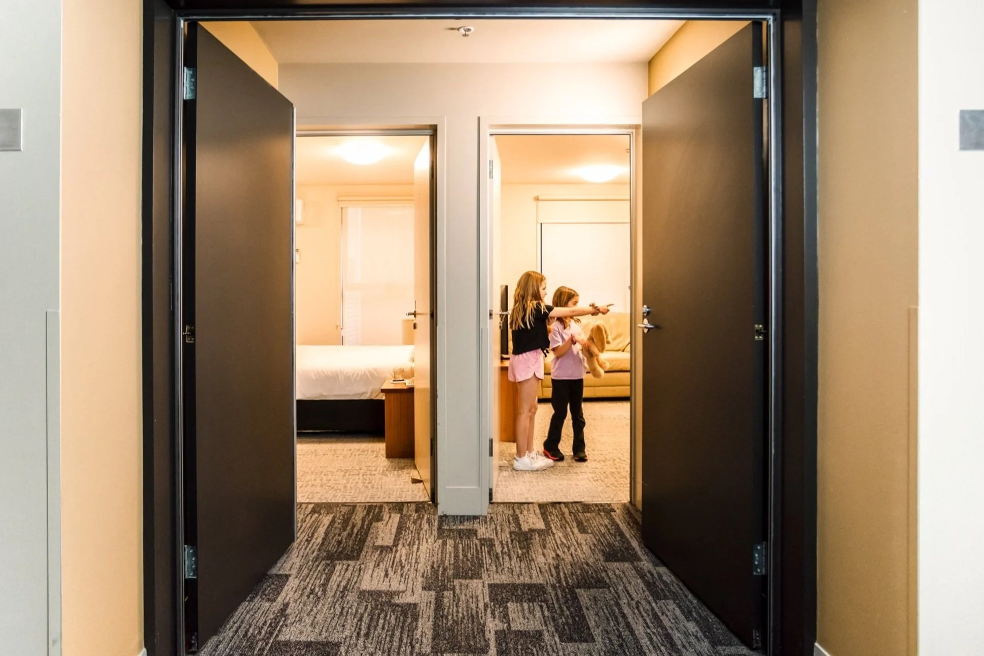 Family at secure connected apartment entrance