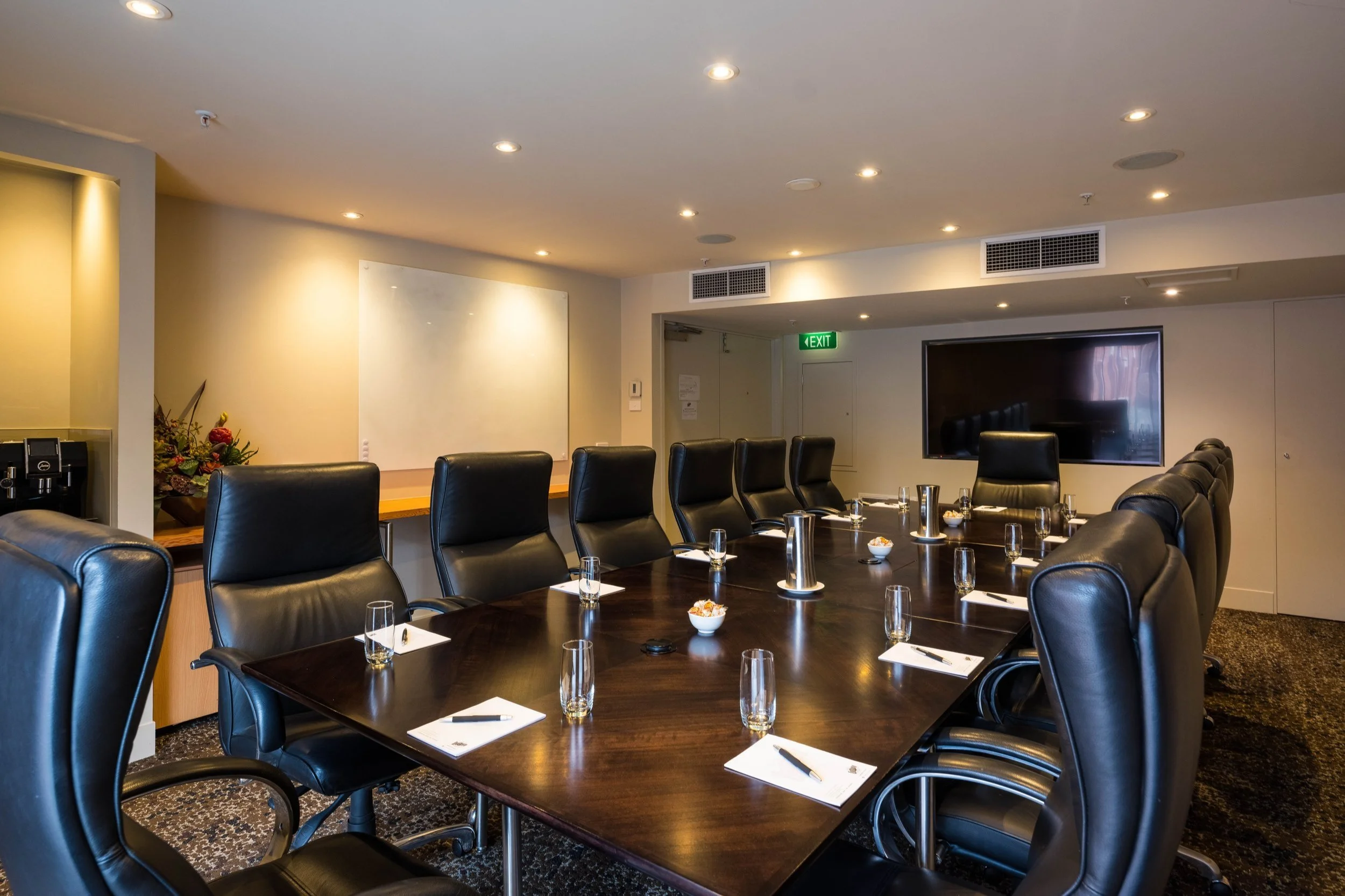 Private boardroom with screen and camera from on-site AV.