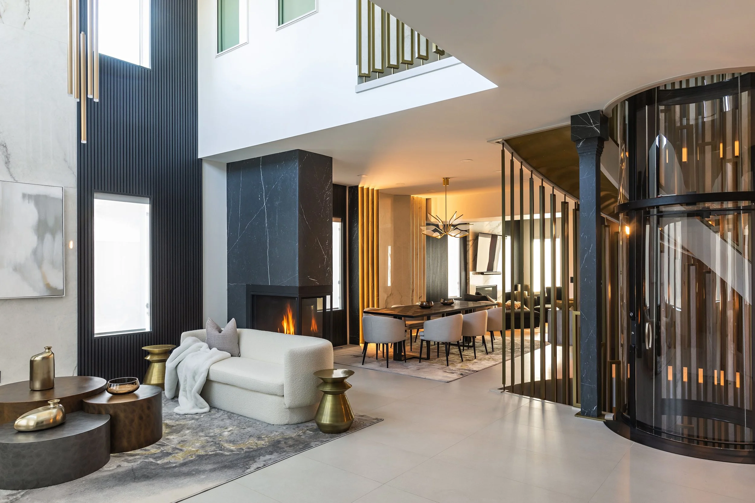 Photo of a luxury open-concept home with high ceilings and white and black walls