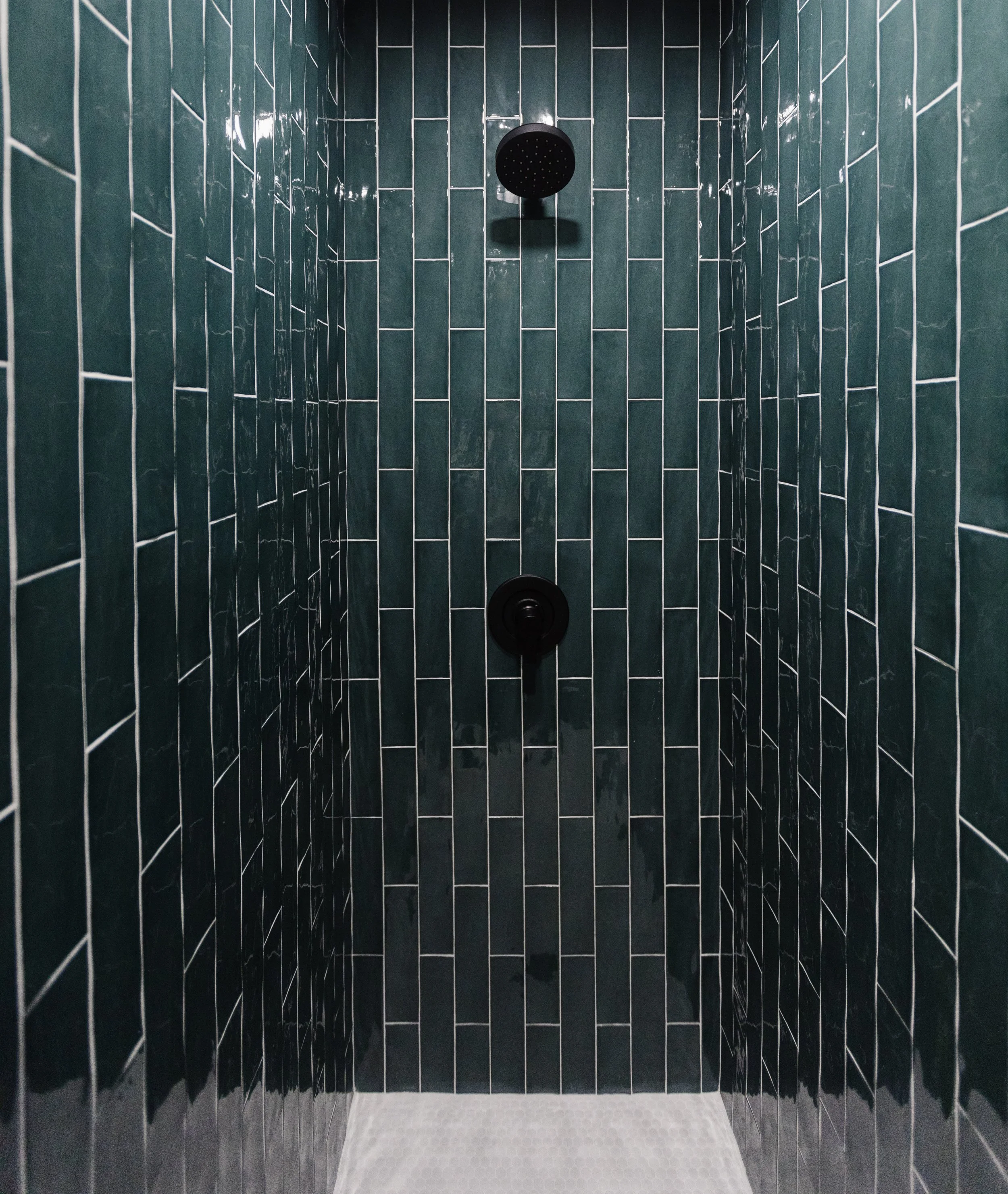 Teal wall tiles washroom design