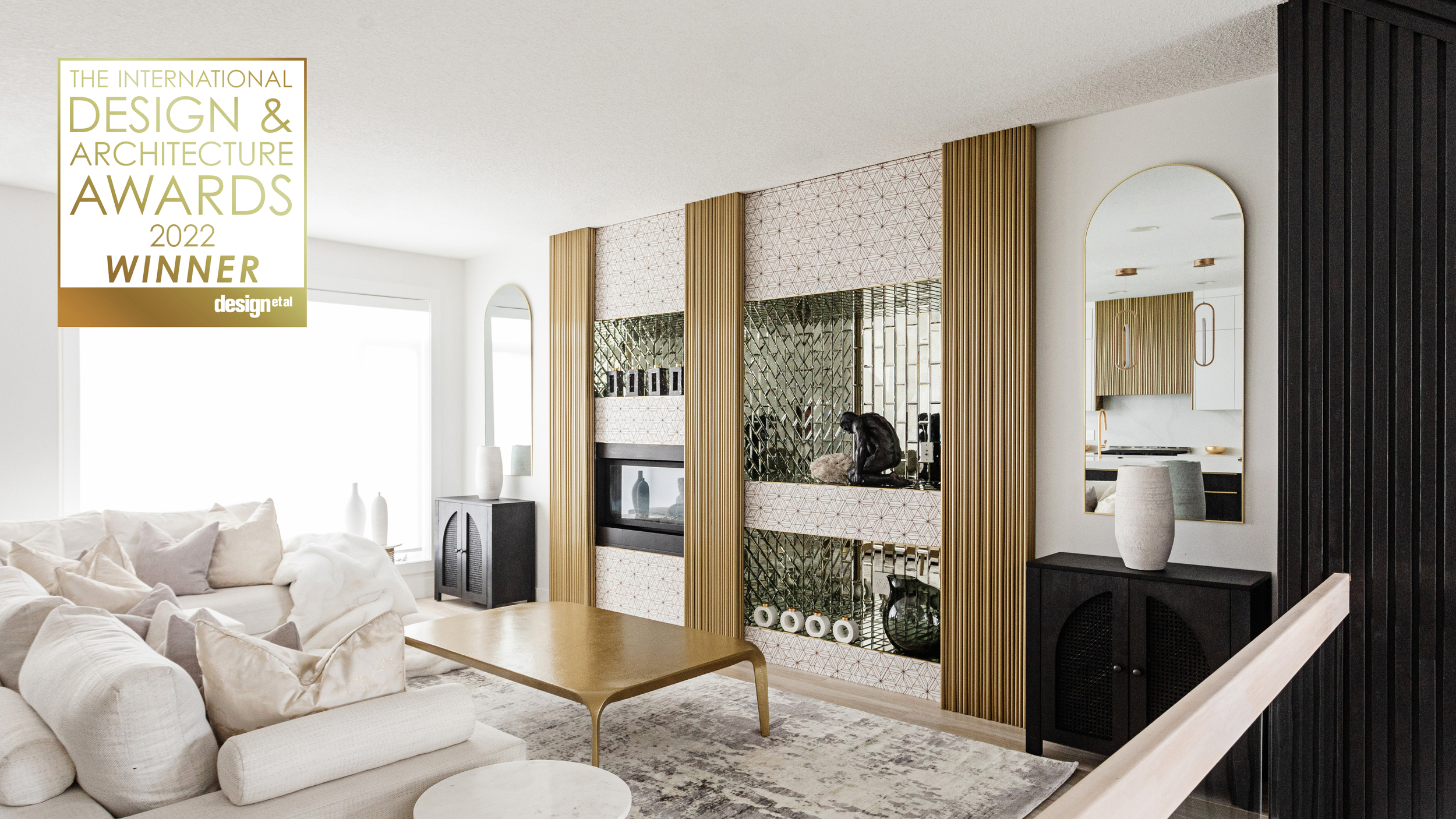Photo of the House of Sevens IDAA 2022 Winner Badge overlayed on a photo of a luxury white and gold designed living room