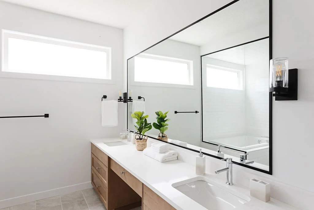 White modern washroom design with large square mirror