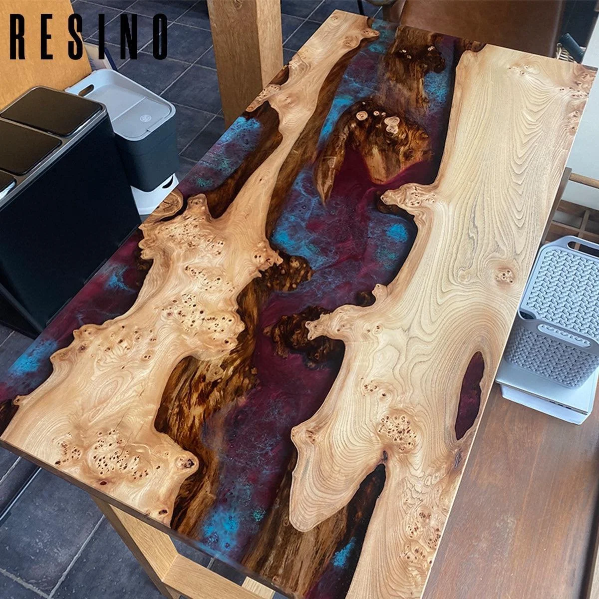 A small (ish!) high table delivered today, elm paired with a metallic maroon base of epoxy with a turquoise design layer floating on top. 
Table frame of oak with foot rest and all elements made to suit other interior items - beams, cooker, worktops 