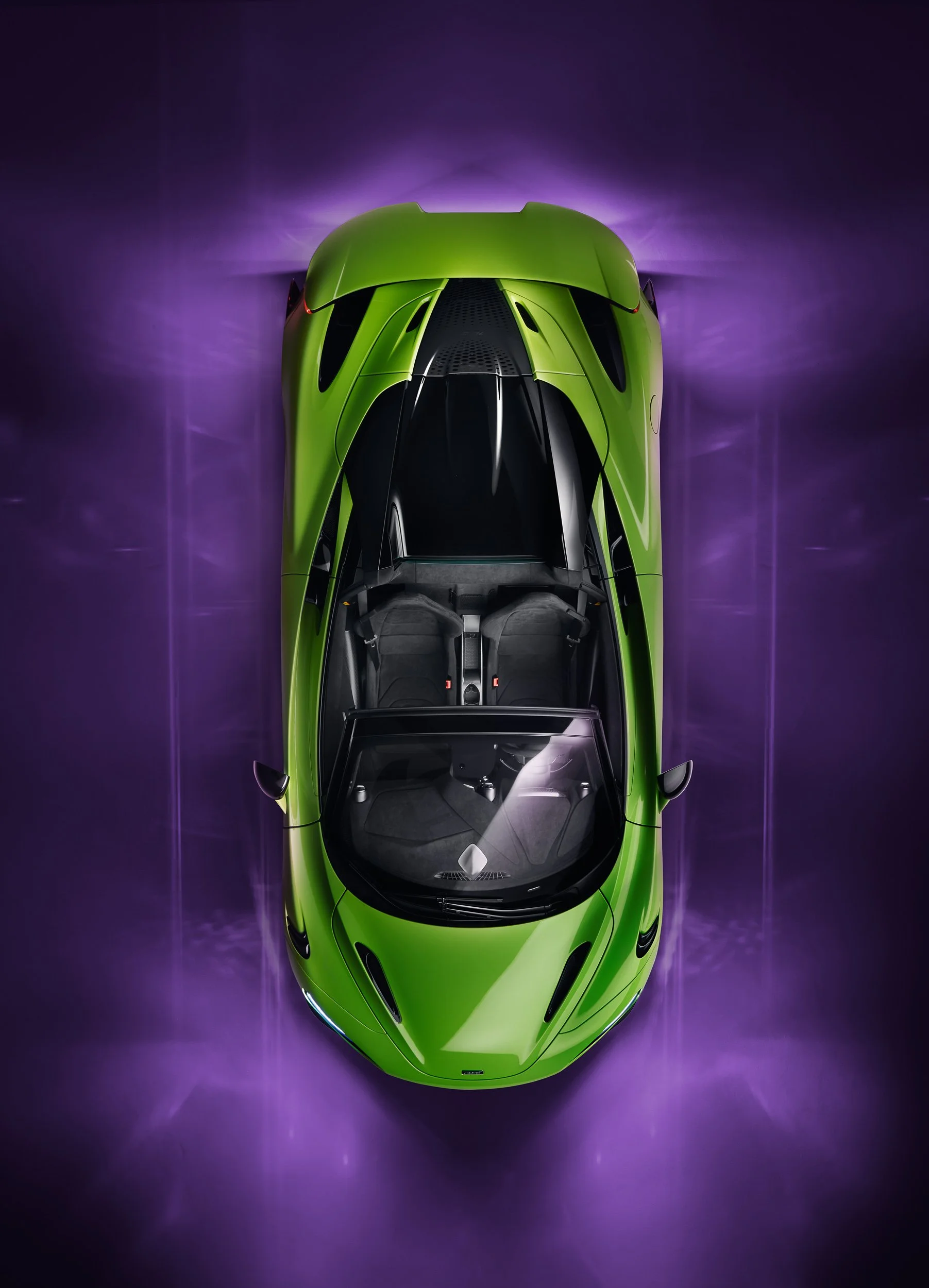 Top view of a green sports car on a purple background