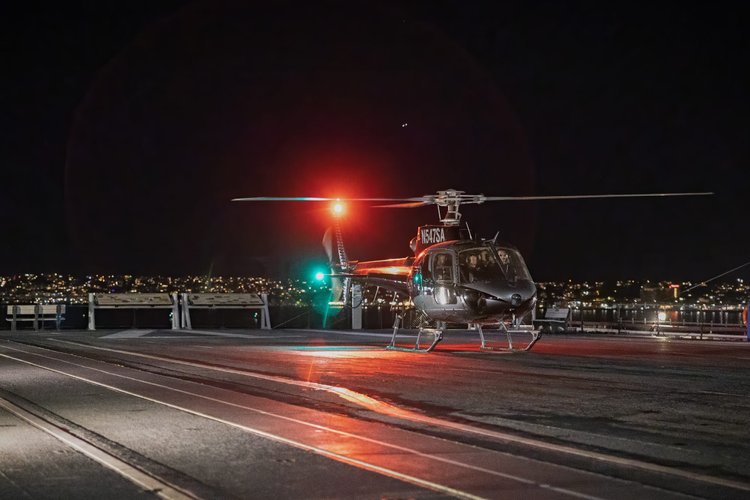 Showboss Productions helicopter VIP arrival on the USS Midway Museum flight deck at night