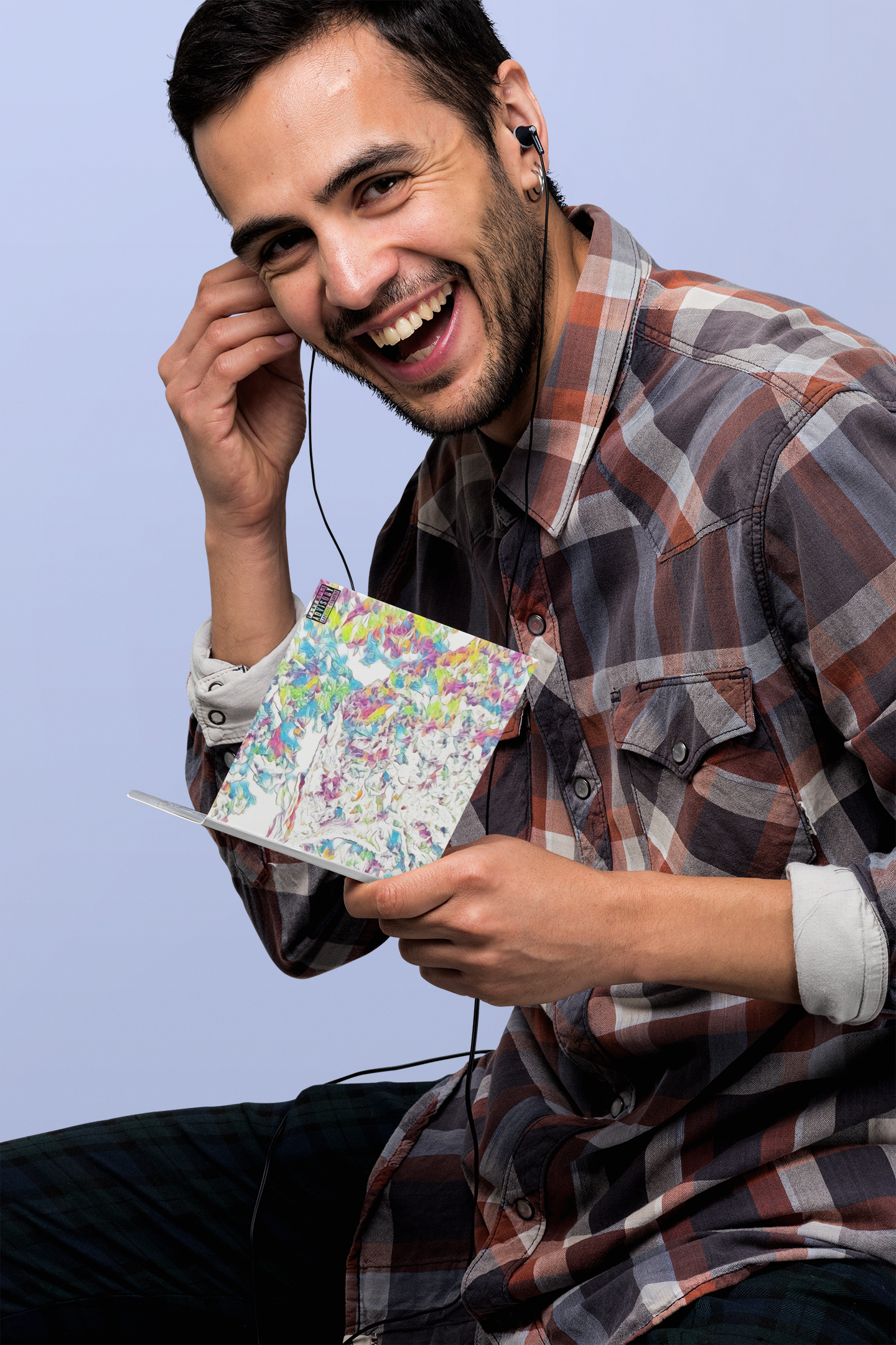 digipak-mockup-featuring-a-smiling-man-listening-to-music-28326.png