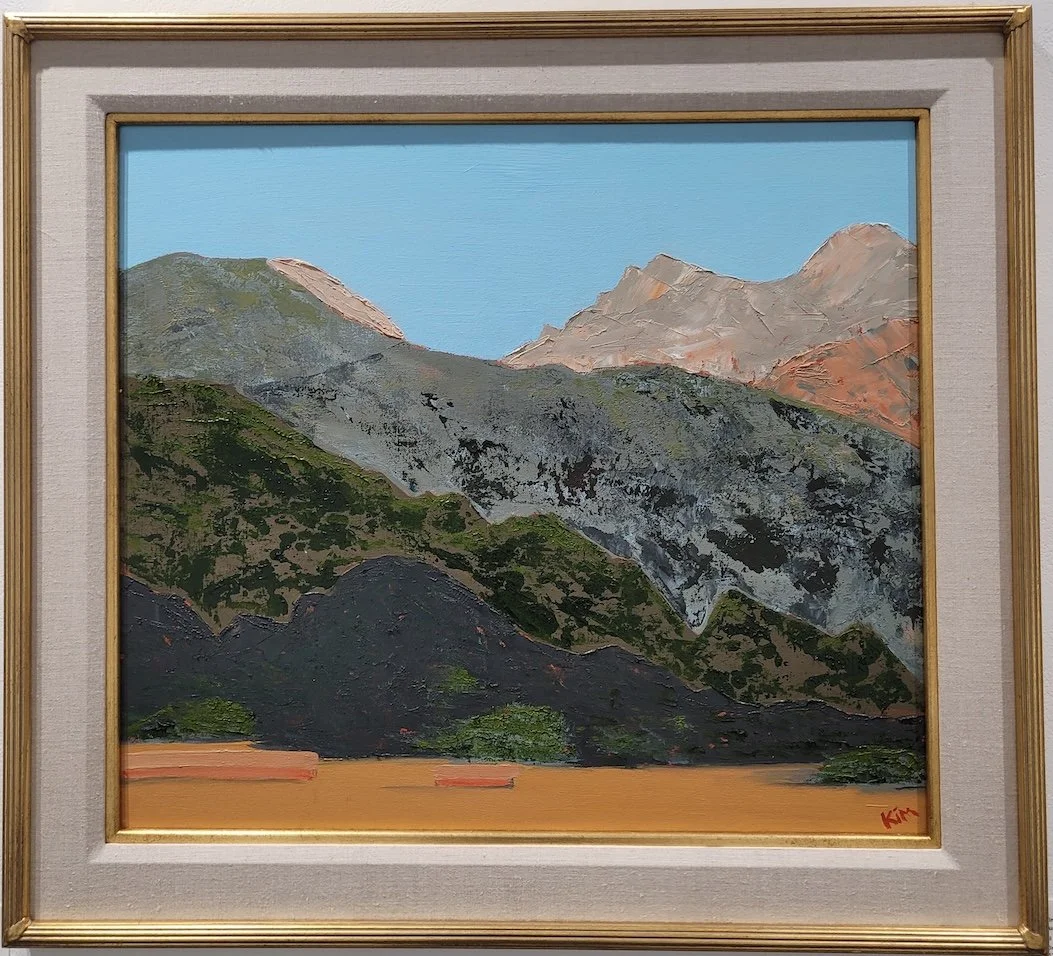 oil painting of orange mountain sunset, framed in gold frame