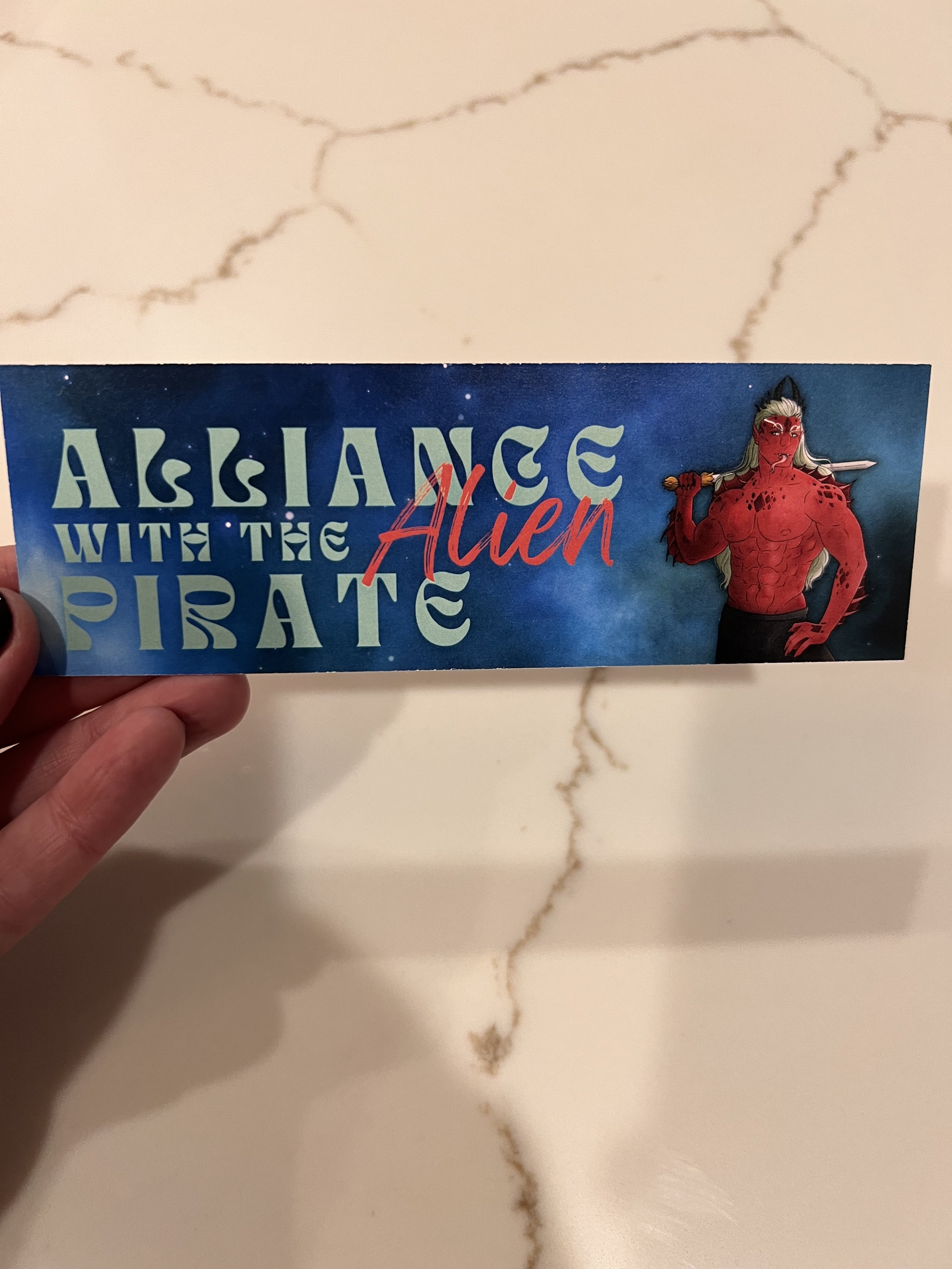 AAP bookmark front held.jpeg