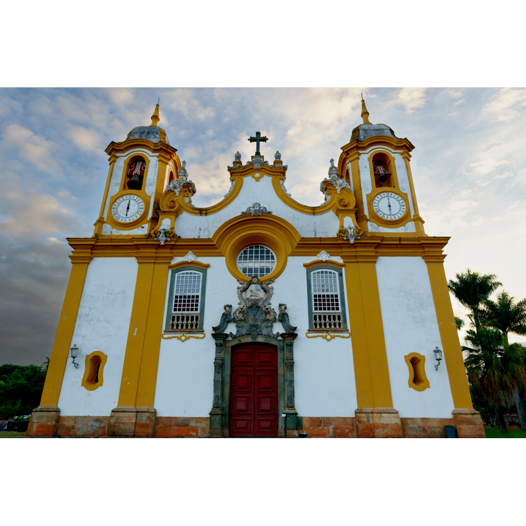 Tiradentes Church – ornate yellow and white colonial church facade with red doors in Tiradentes Brazil