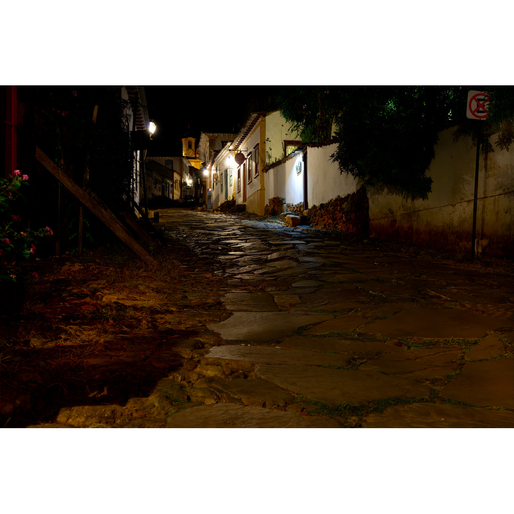 Lantern Light on Cobblestones – warm lantern-lit cobblestone street at night in Tiradentes Brazil