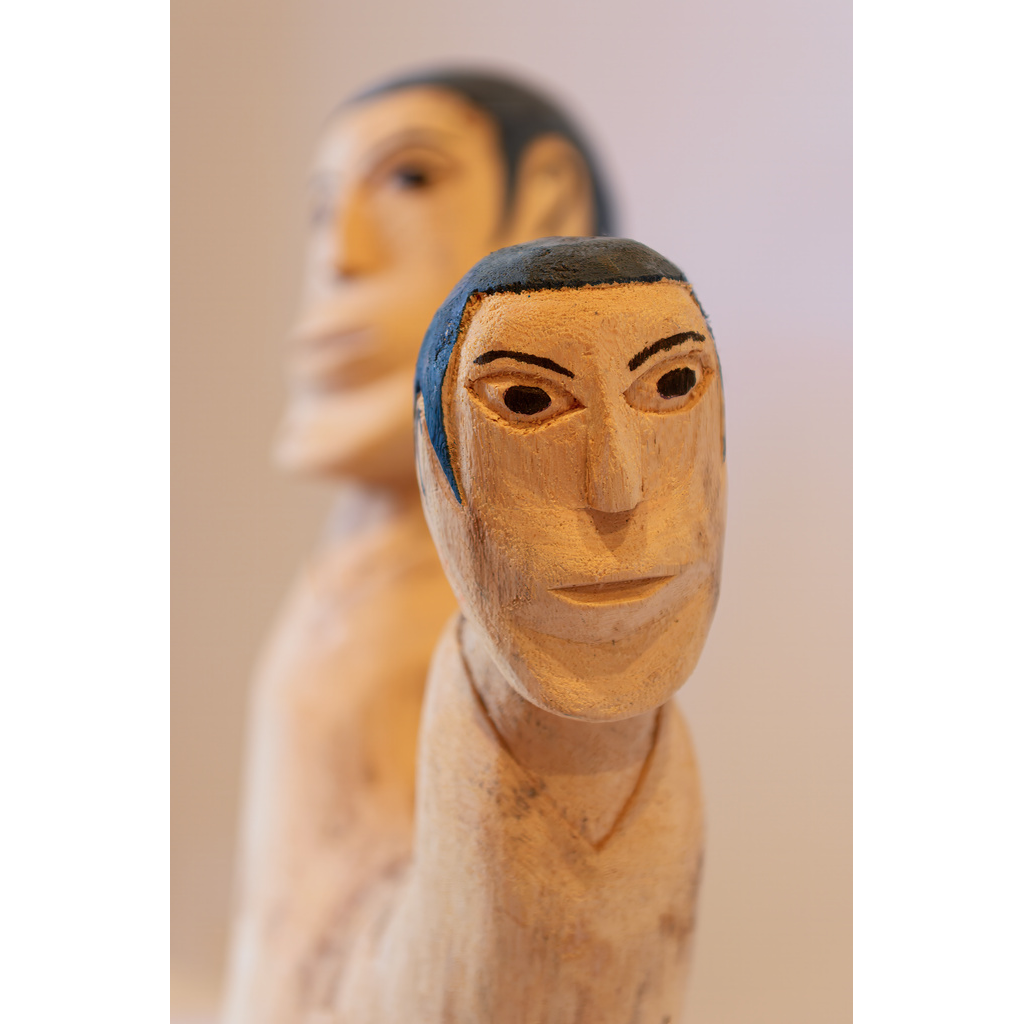 Brazilian Wooden Sculptures – close-up of hand-carved wooden folk art figures with expressive faces