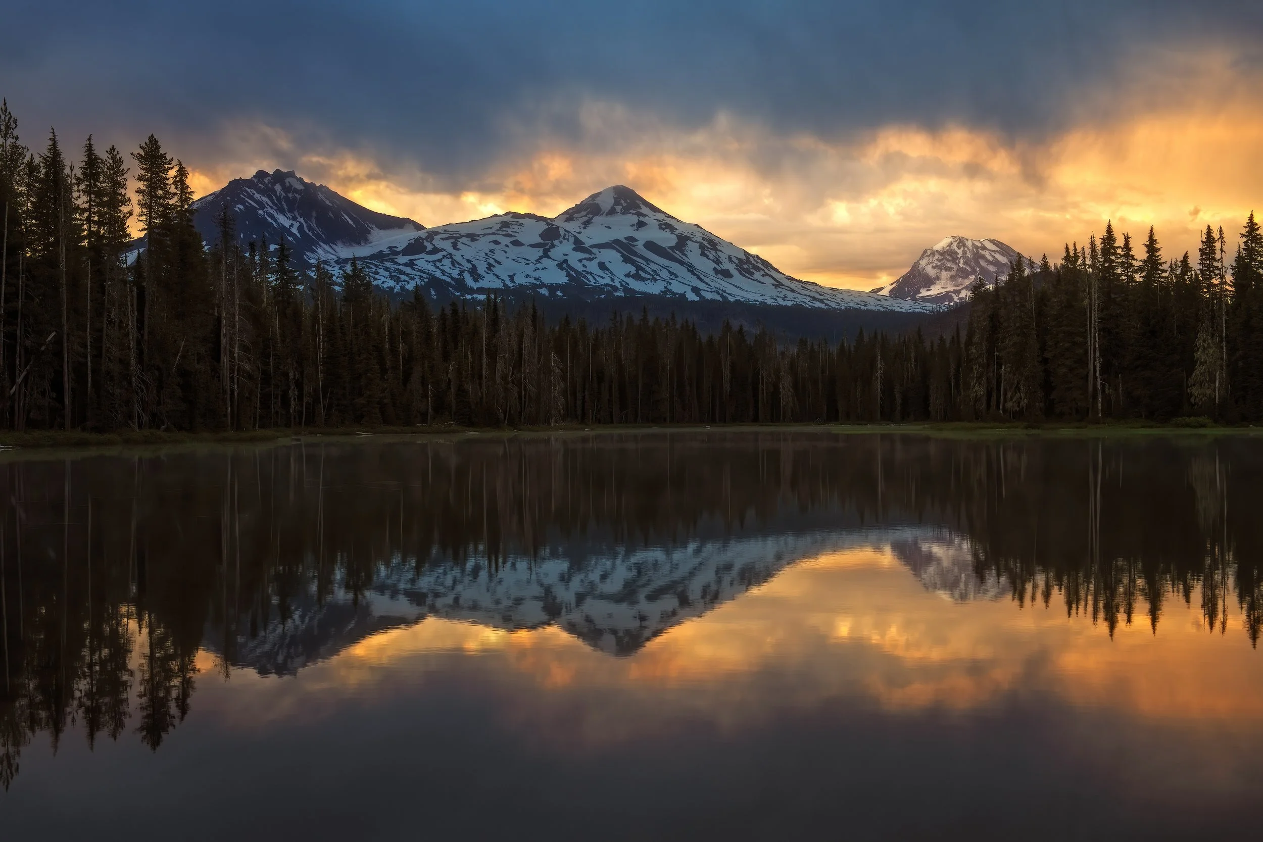 Fine art landscape photography at Scott Lake, Oregon during a fiery sunrise, captured by Andrew Sambuceto