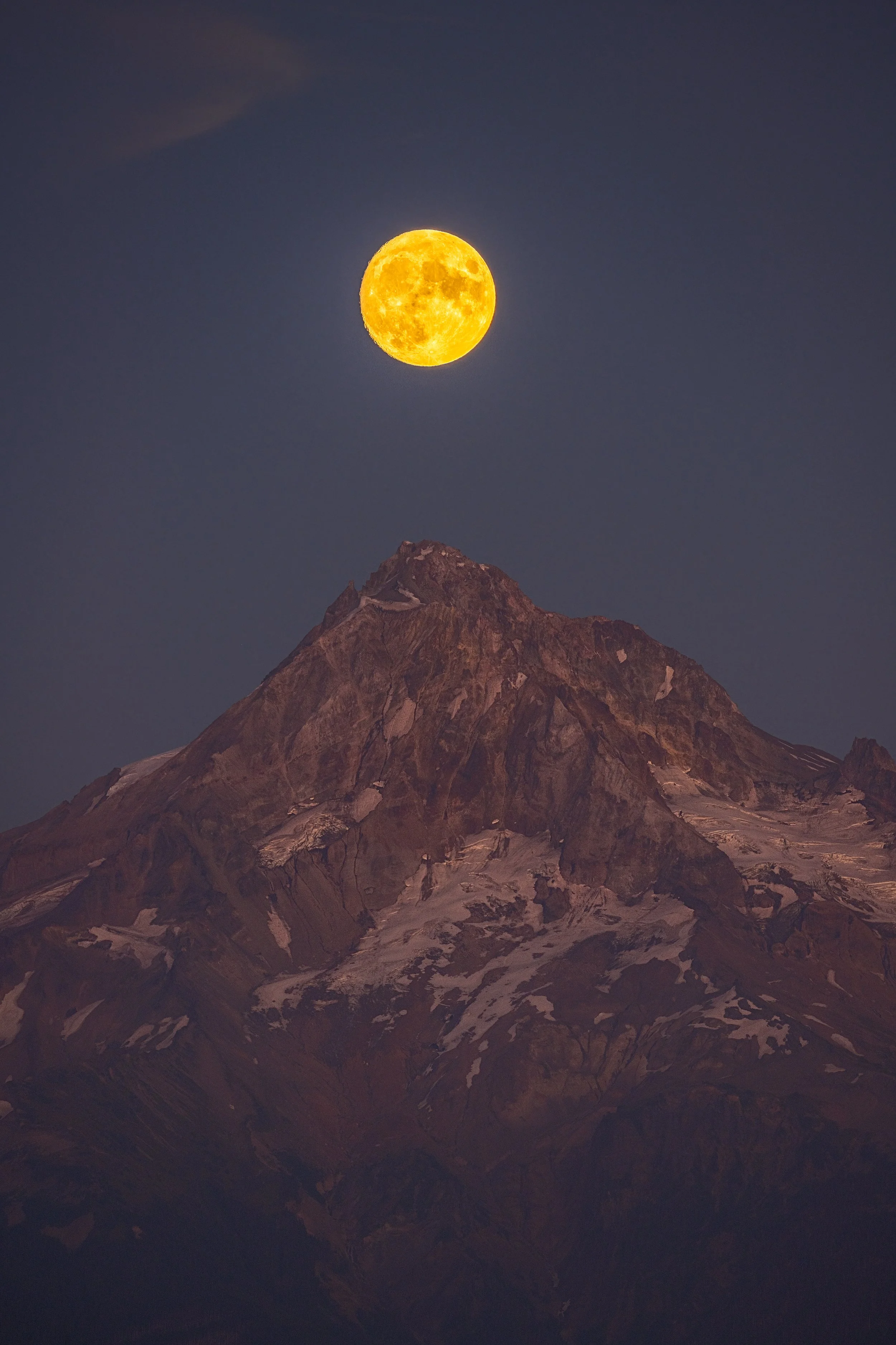 A Fine art landscape photograph of the full moon alignment with Mt. Hood, captured by Andrew Sambuceto.