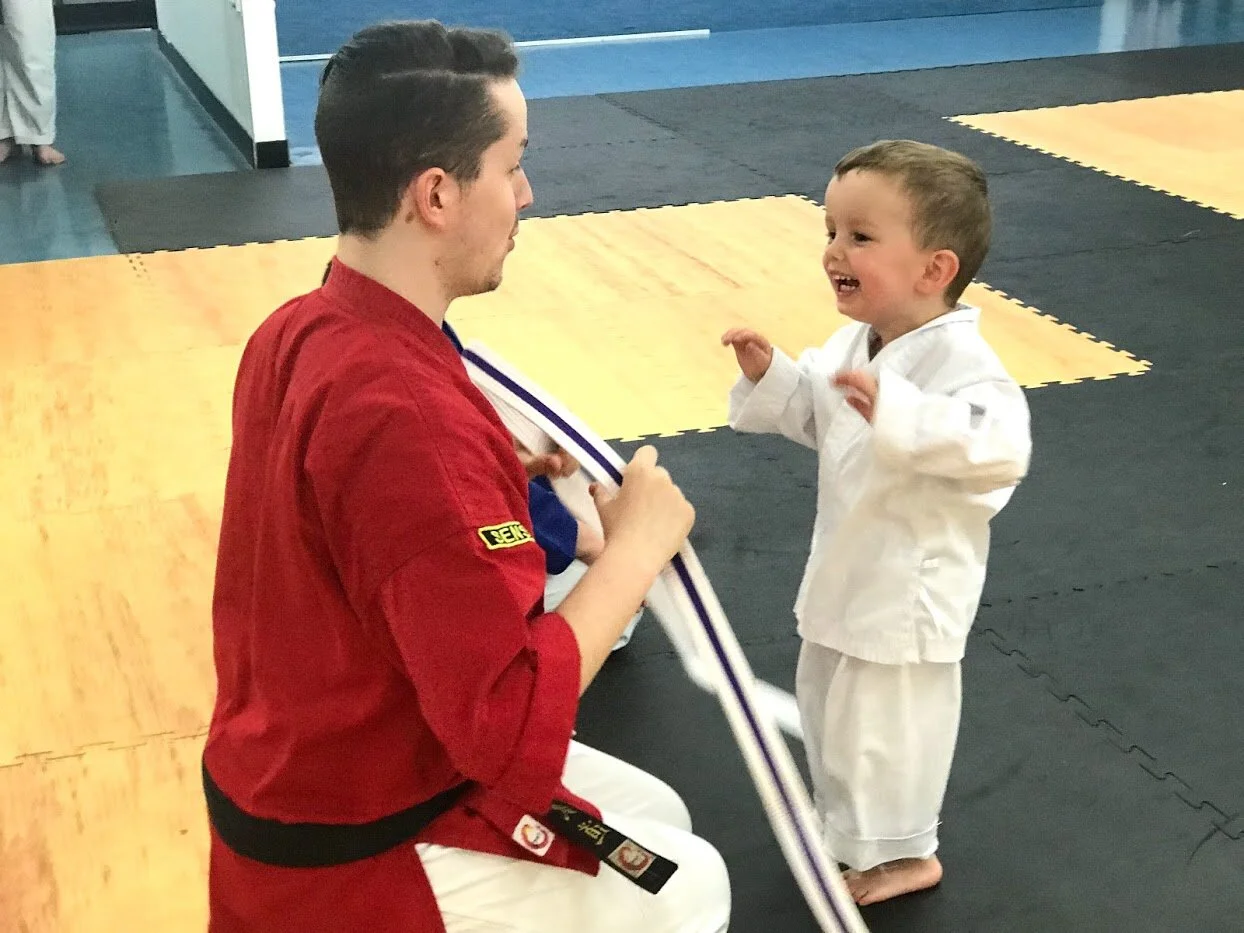 Sam teaching tiny dragon.jpg