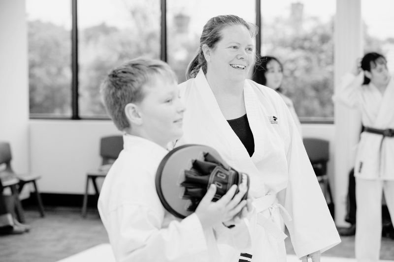 Parents and teenagers training karate together in a family friendly martial arts class in Hornsby