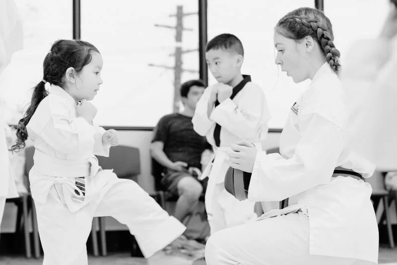 Black and white photo of toddlers aged 3–4 participating in a preschool karate class in Hornsby