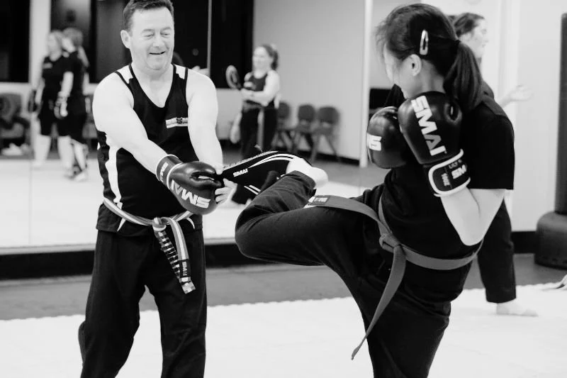 Students learning practical self defence skills during a kickboxing class in Hornsby NSW