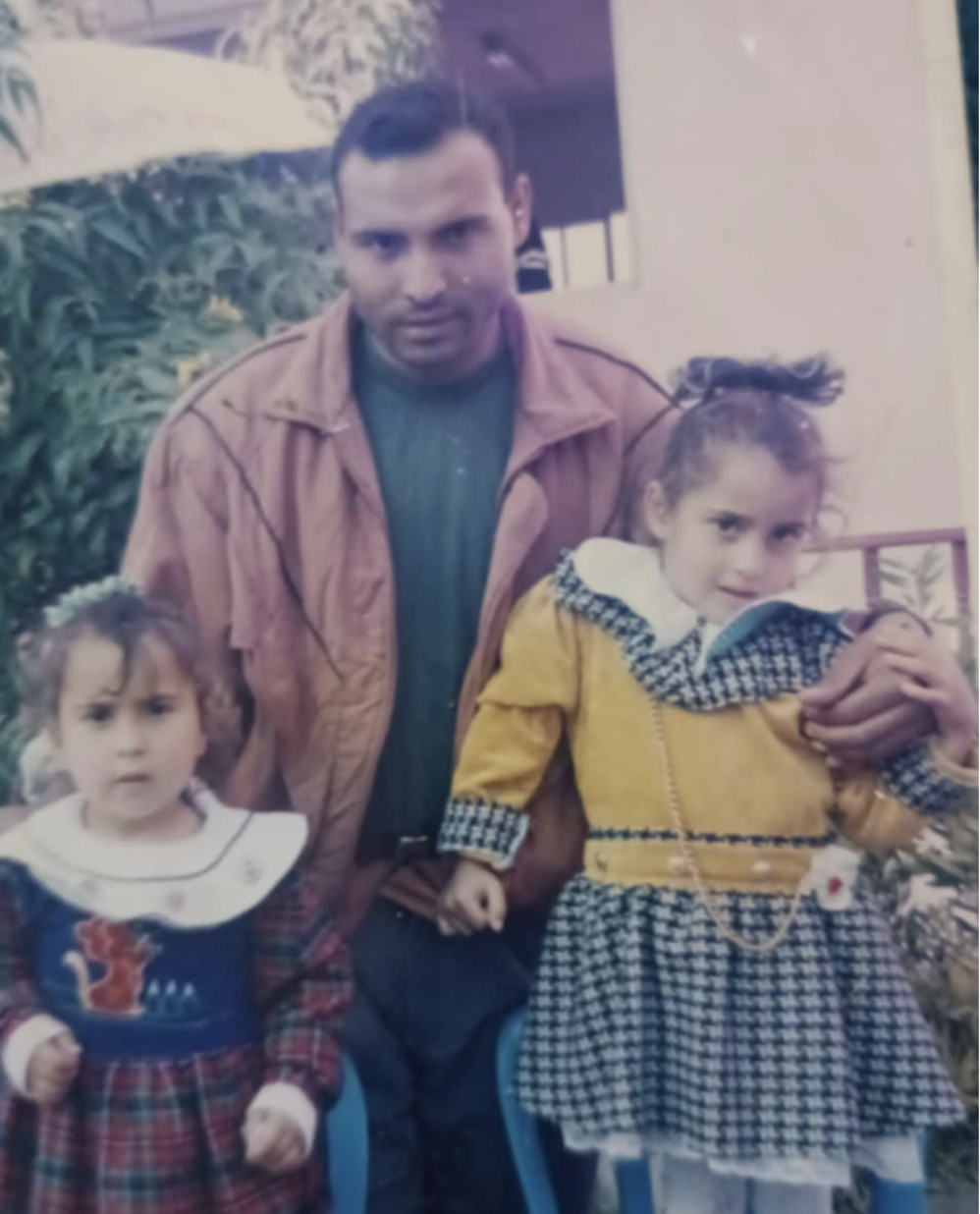 Haneen Sabbah with her father Abed El Kareem Sabbah and a family member in a photograph from the 1980s