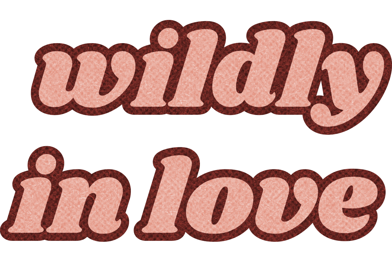 Text reading "wildly in love" with a pink and red glittery design.