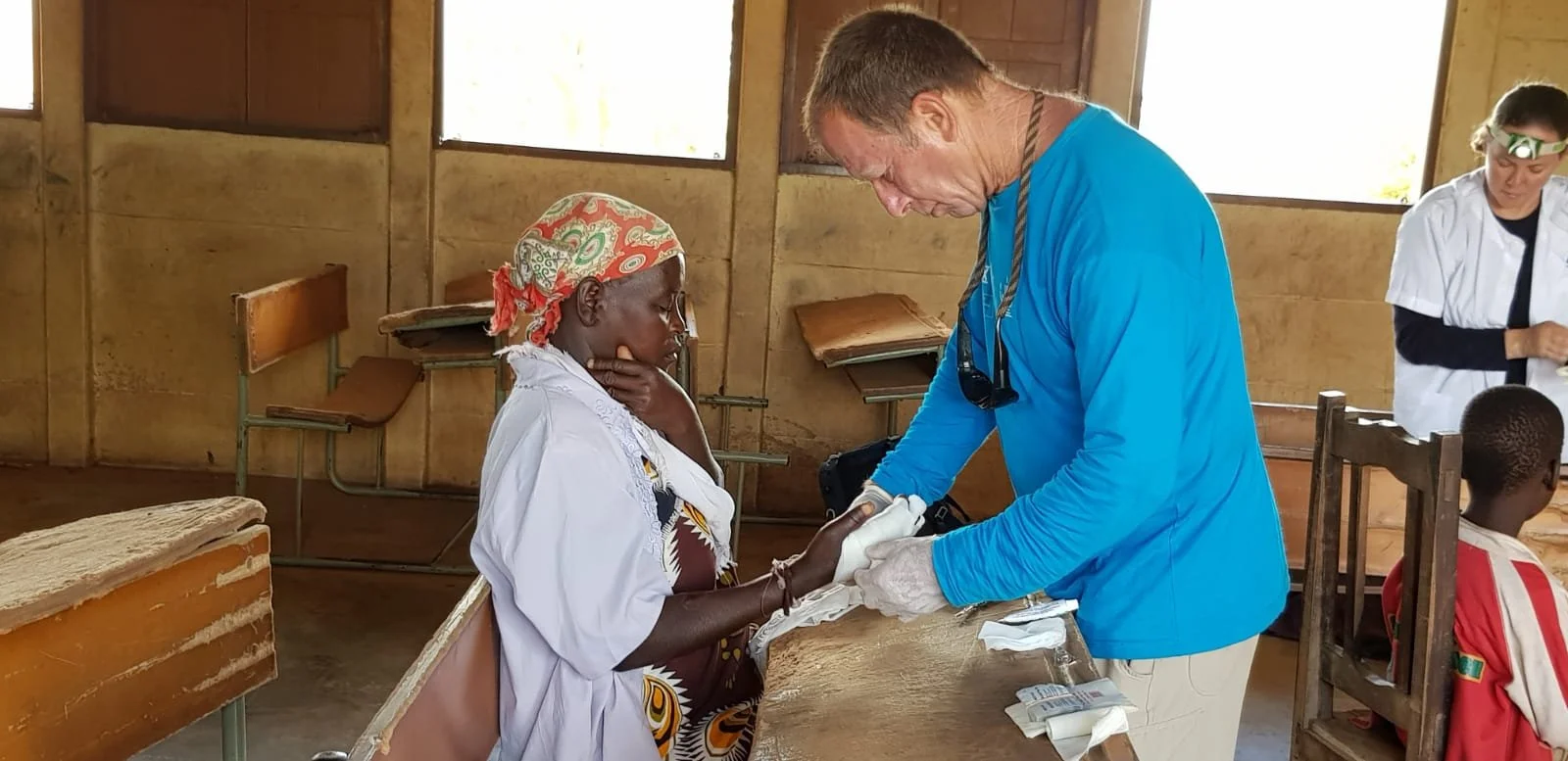 NATAN DOCTOR AND PATIENT AT FIELD CLINIC NEAR BEIRA MOZAMBIQUE FOLLOWING CYCLONE IDAI - 2019