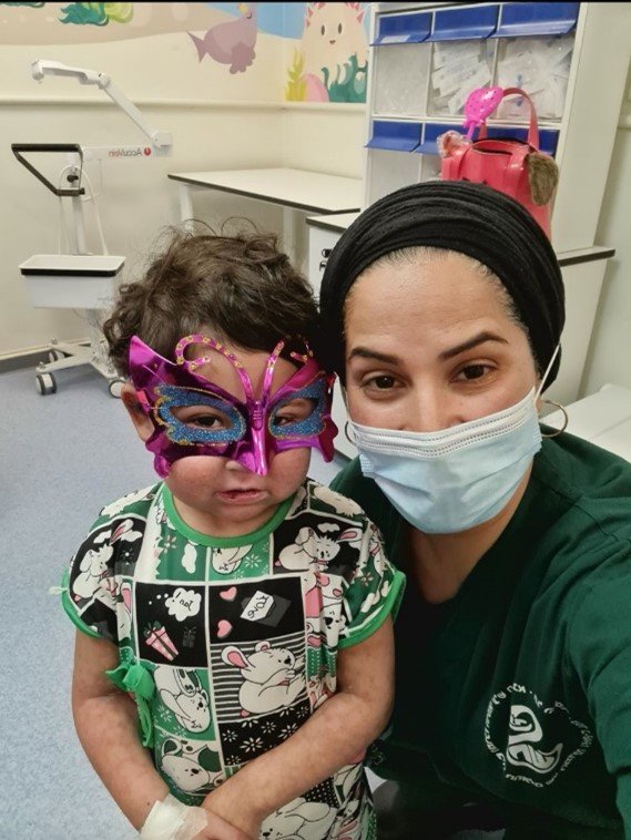 Faida with a young cancer patient