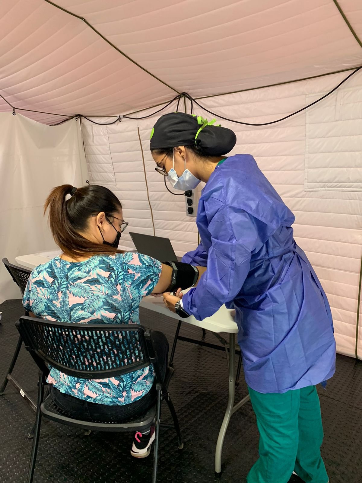 Doctor performs exam at the medical clinic for migrant women in Cucuta Colombia