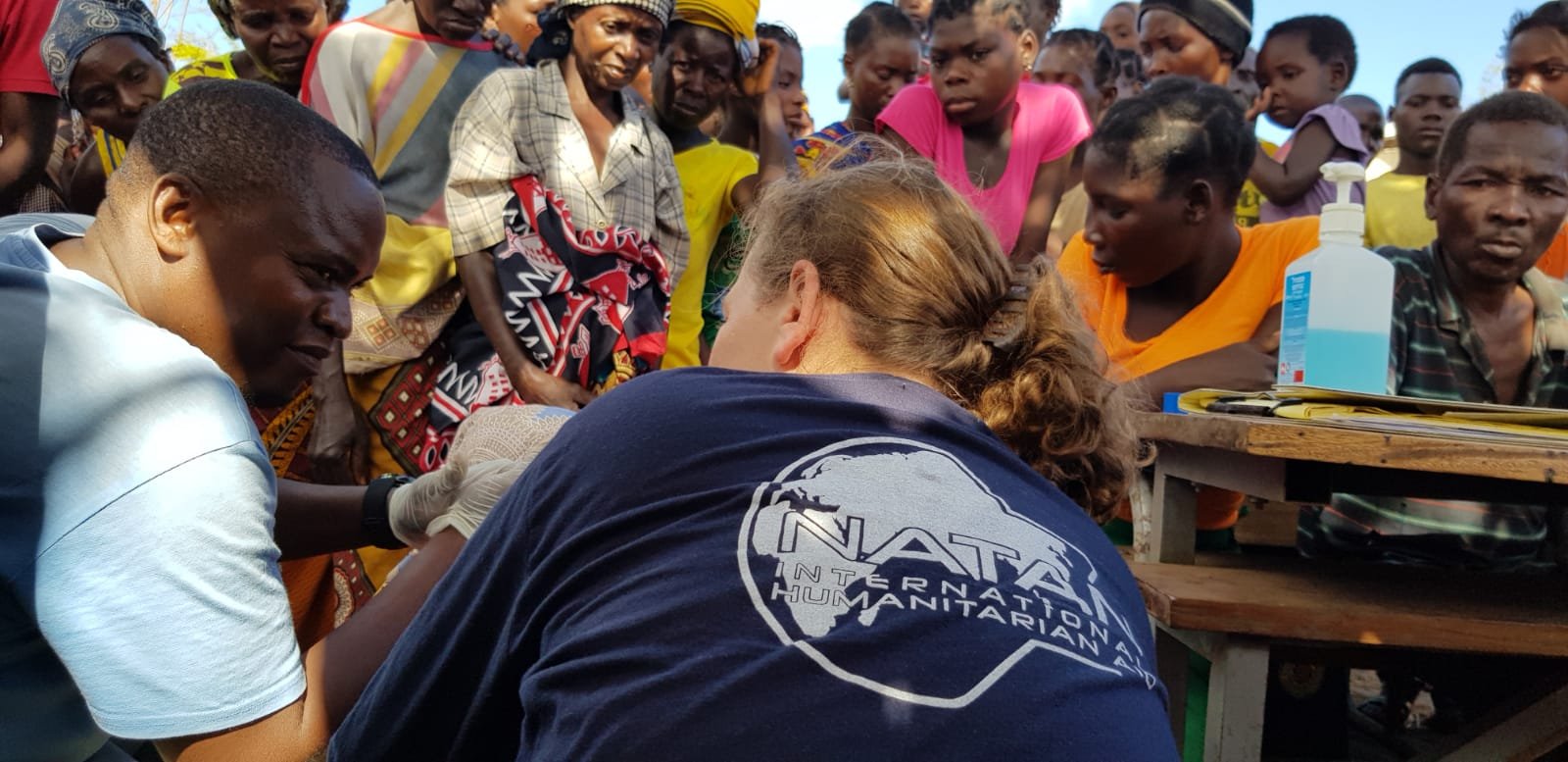 PATIENTS AT OUTDOOR FIELD CLINIC NEAR BEIRA MOZAMBIQUE FOLLOWING CYCLONE IDAI