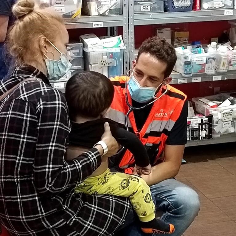 NATAN Pediatrician Dr. Oren Scheffner treats a child at the clinic