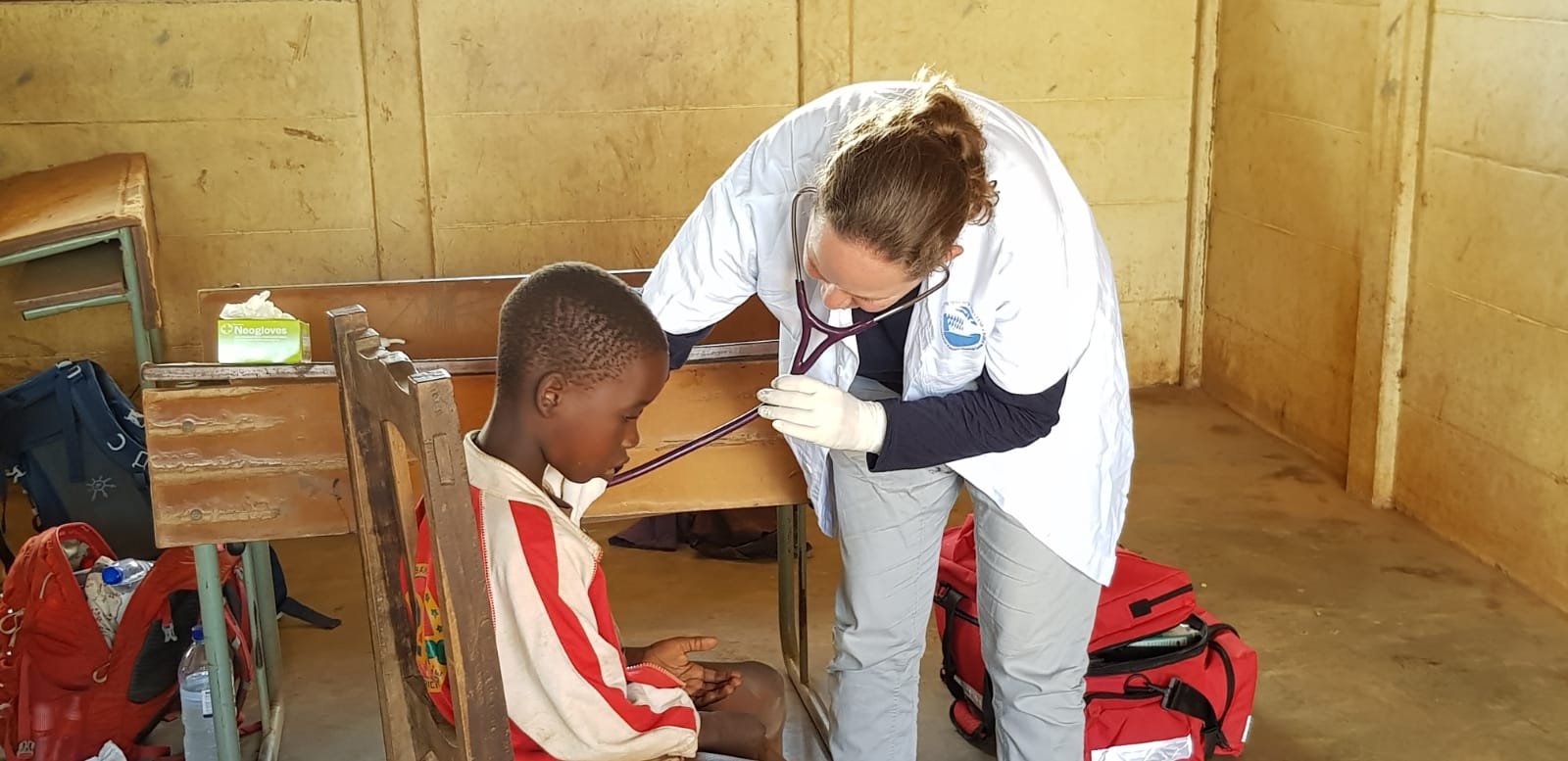 NATAN DOCTOR AND PATIENT AT FIELD CLINIC NEAR BEIRA MOZAMBIQUE FOLLOWING CYCLONE IDAI - 2019