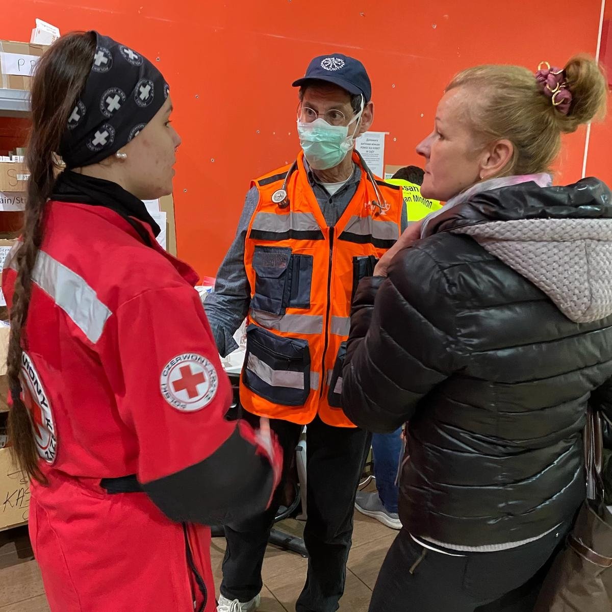 Dr Avery Hart consults with a Red Cross volunteer