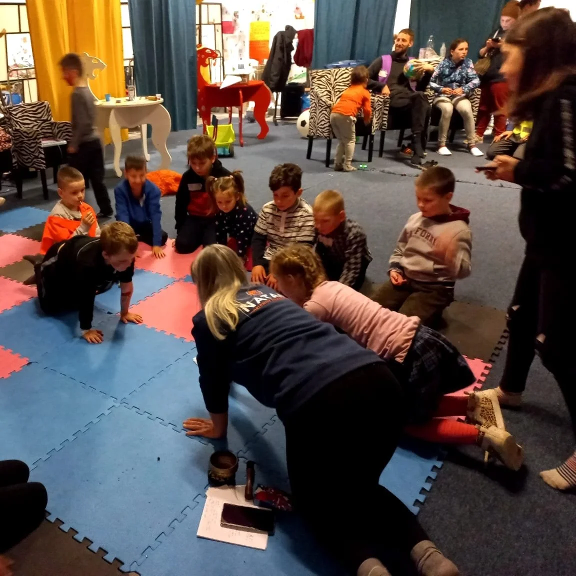 NATAN Nurse Natali Sinchuk Power leading a children's yoga session at the refugee center