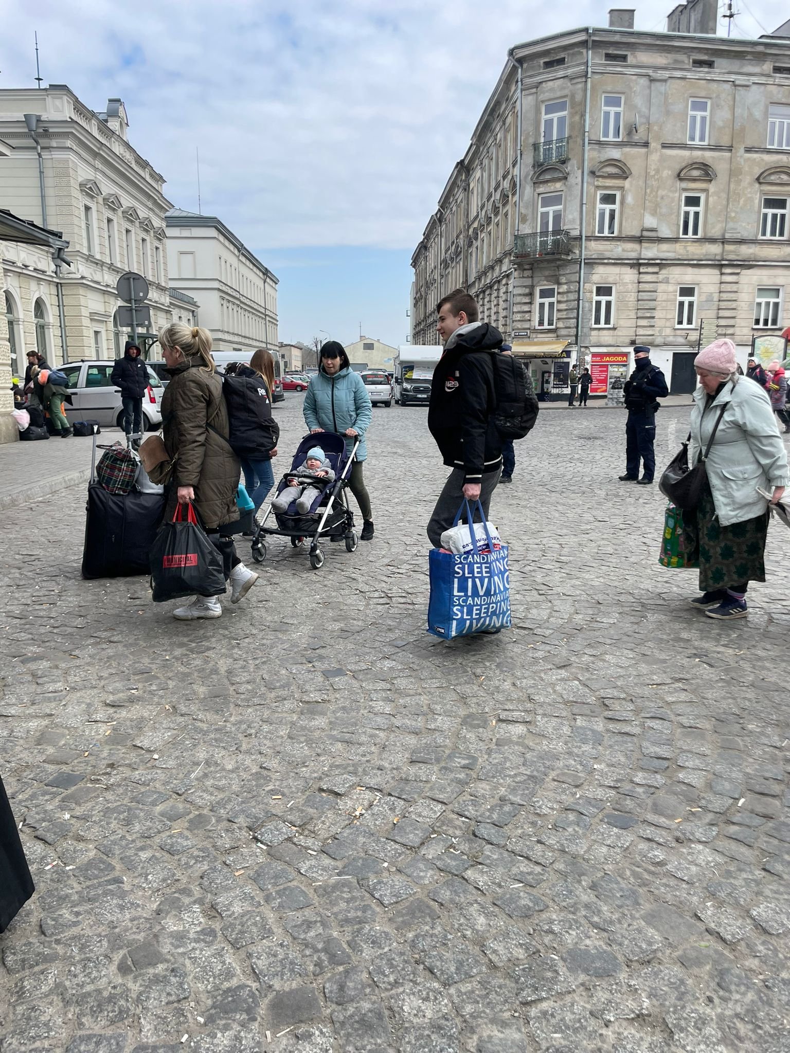 Ukrainian refugees walking to Przemysl train station in Poland